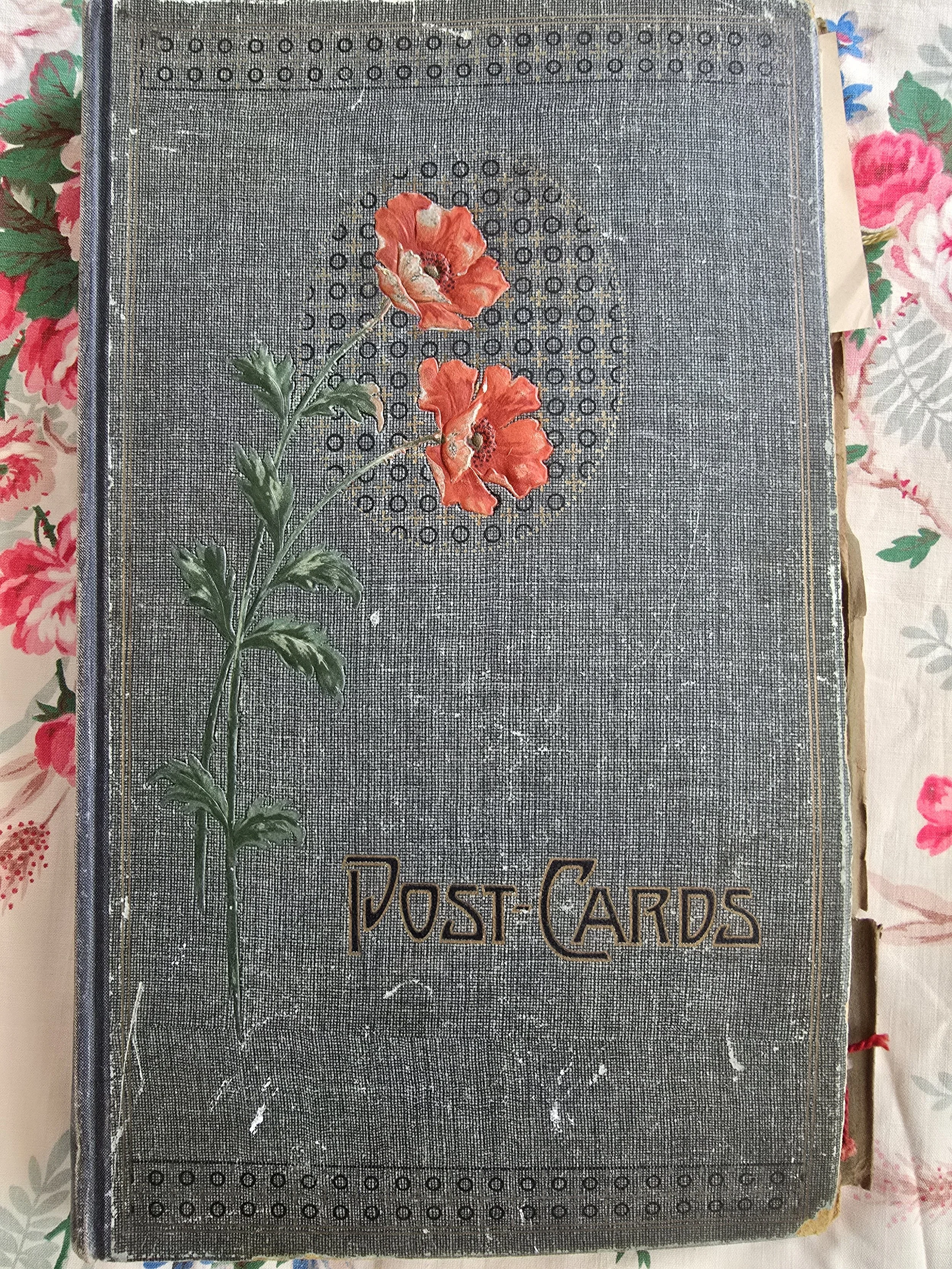 Antique postcard album cloth cover with red poppy flower embossed design