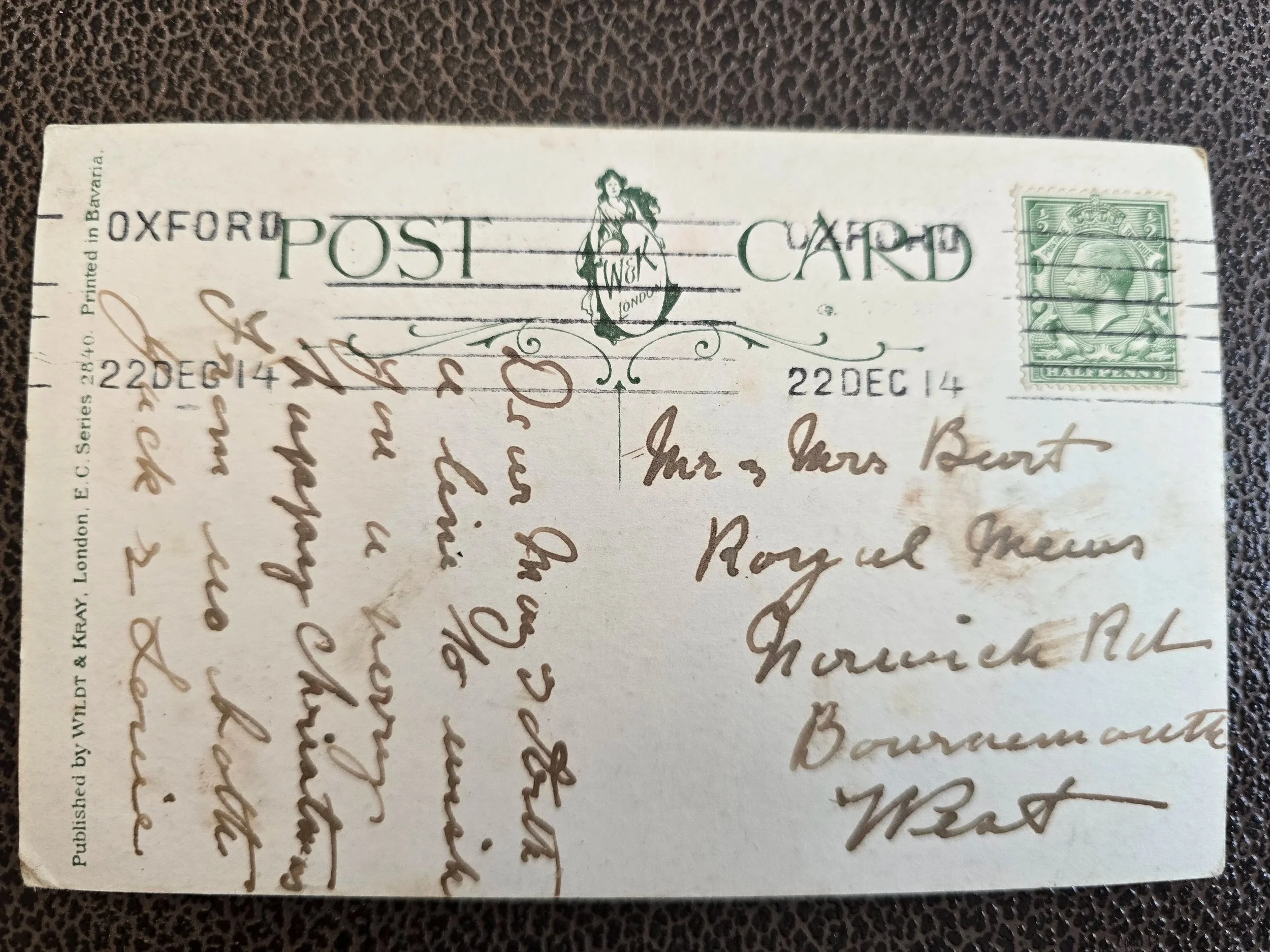 Reverse of an antique Christmas postcard published by Wildt & Kray, with handwritten message, green halfpenny stamp and Oxford postmark dated 22 December 1914.