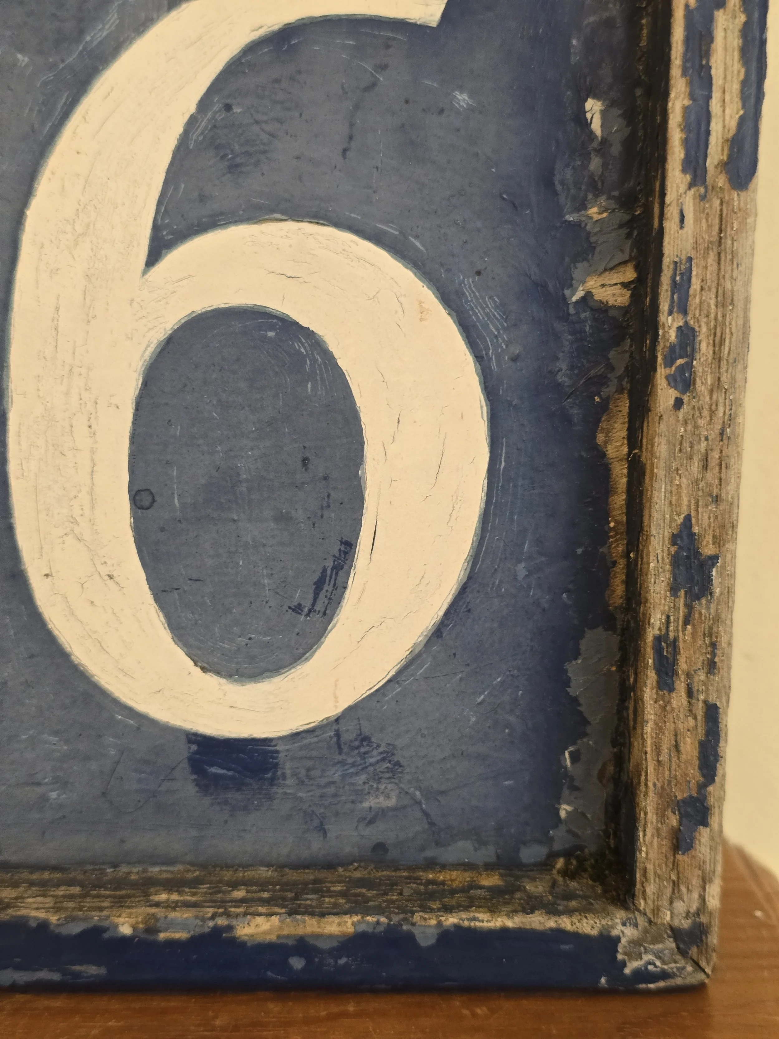 Detail of vintage painted number 46 showing authentic wear and character.