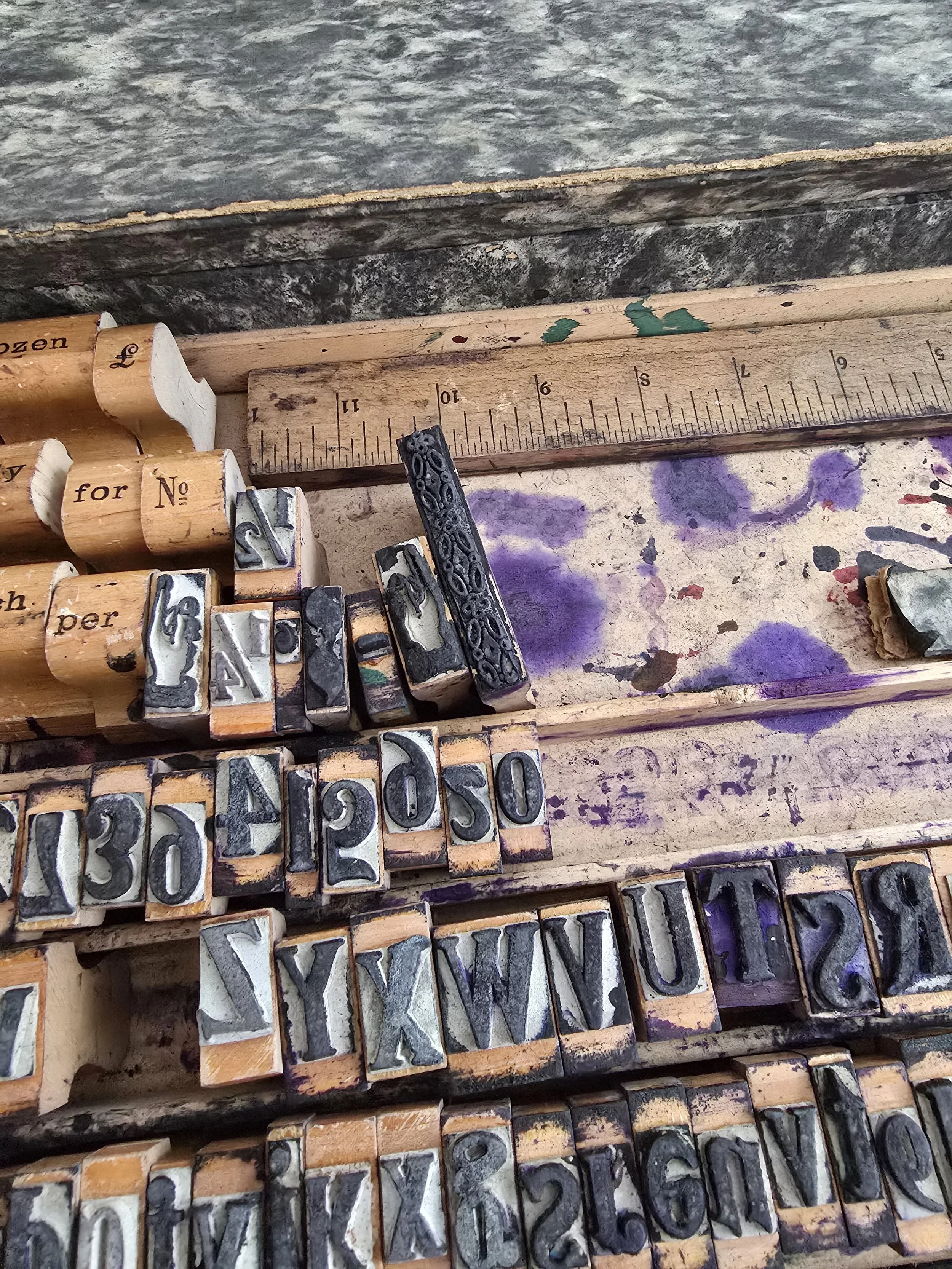 Full view of boxed rubber stamp set with alphabet and numbers.