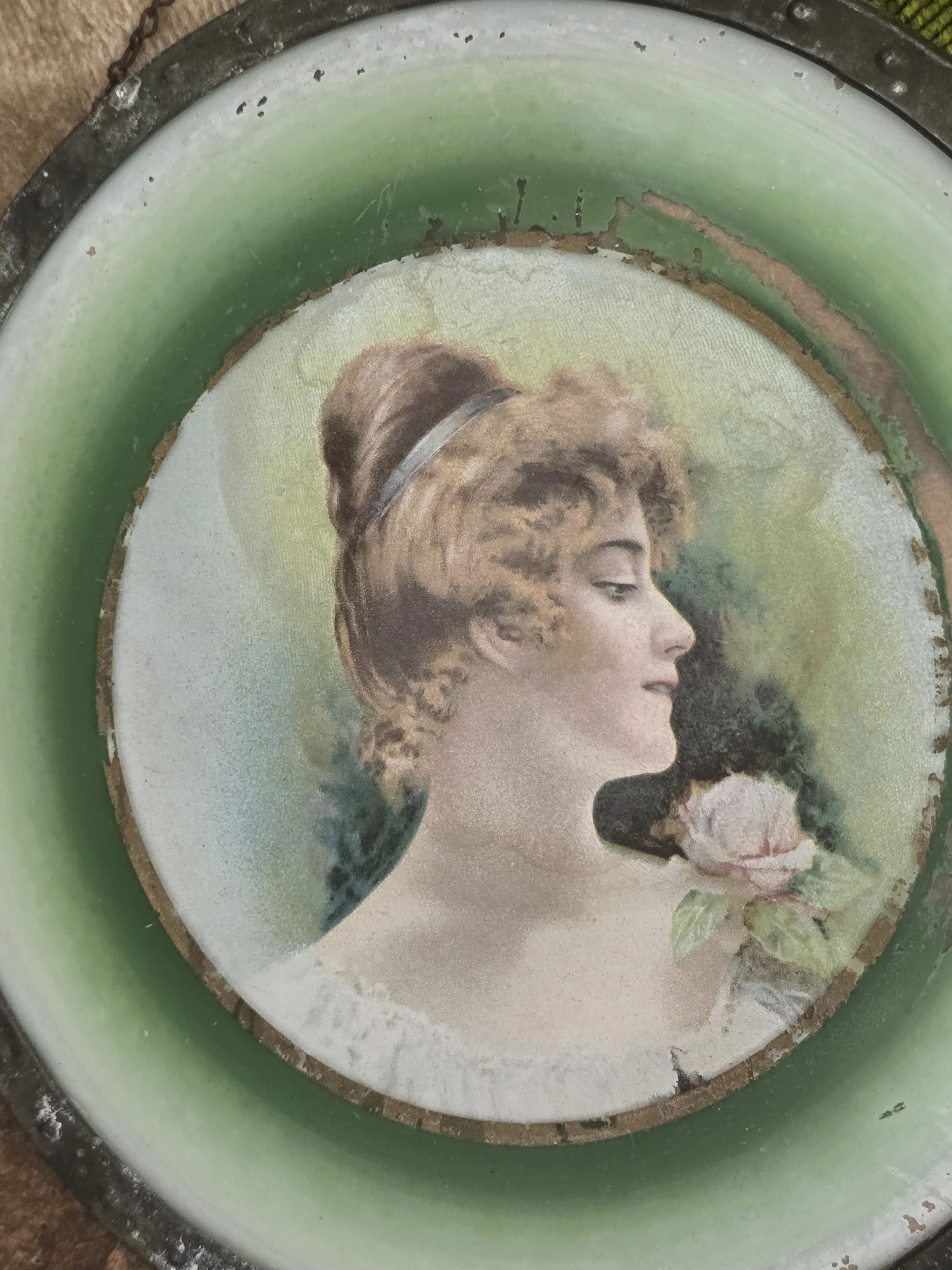 Edwardian style female portrait in original circular metal frame.