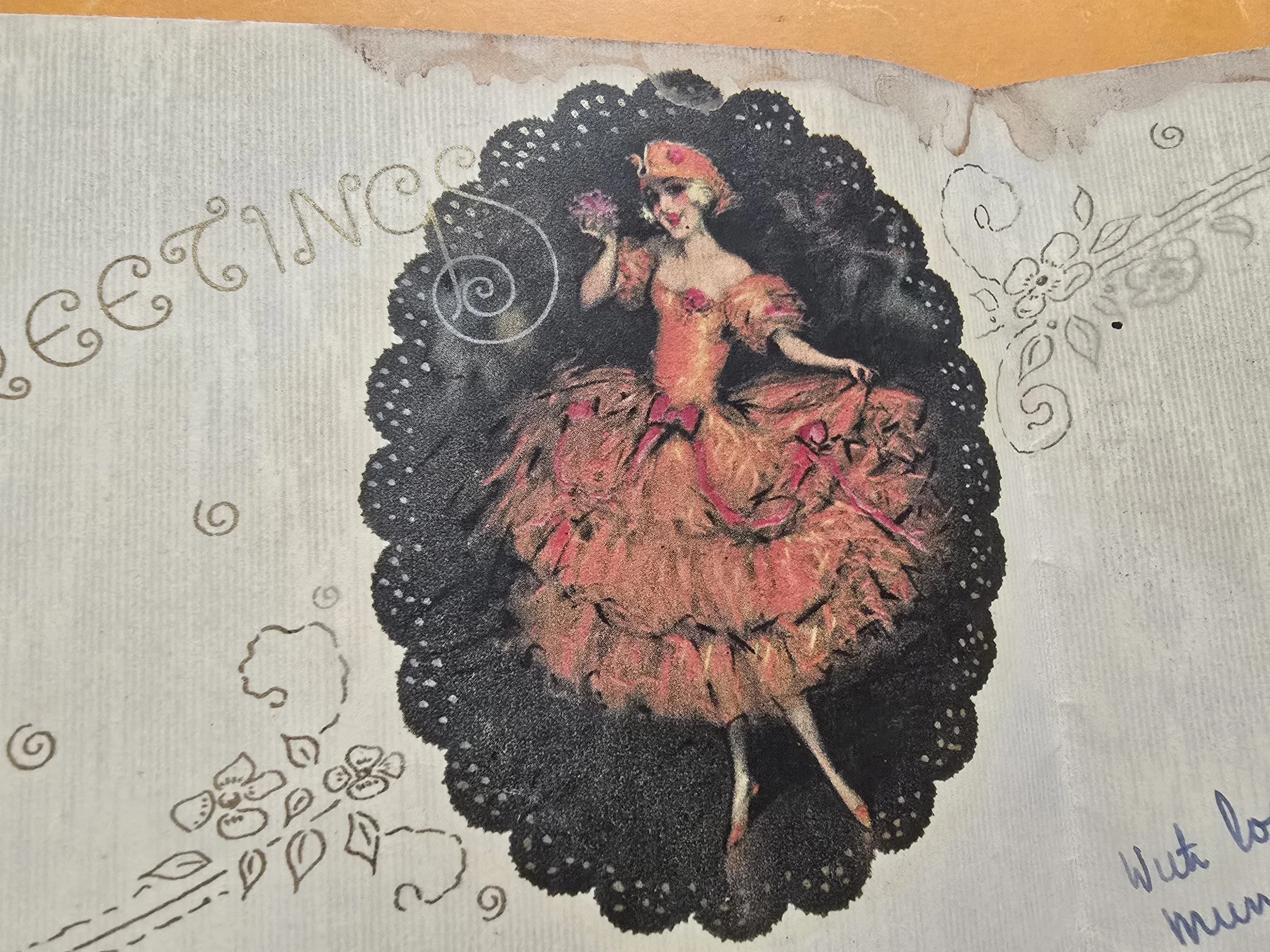 View of inside page with decorative printed border and dramatic red-dressed dancer illustration