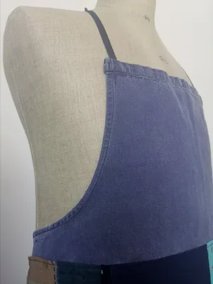Side profile of customised French artisan apron on mannequin