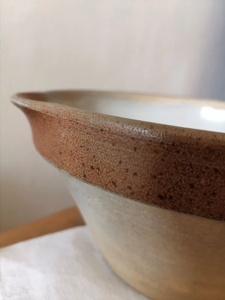 Detail of rim and pouring lip on vintage French stoneware bowl