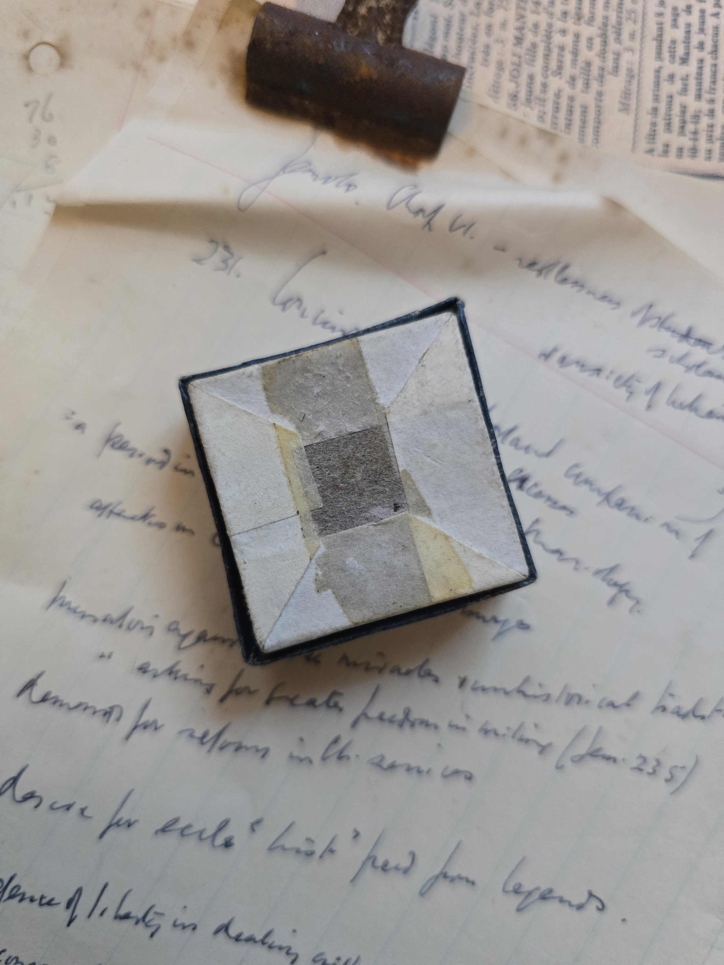 Underside of Studio Made vintage jewellery box showing original aged paper, wear and old adhesive.