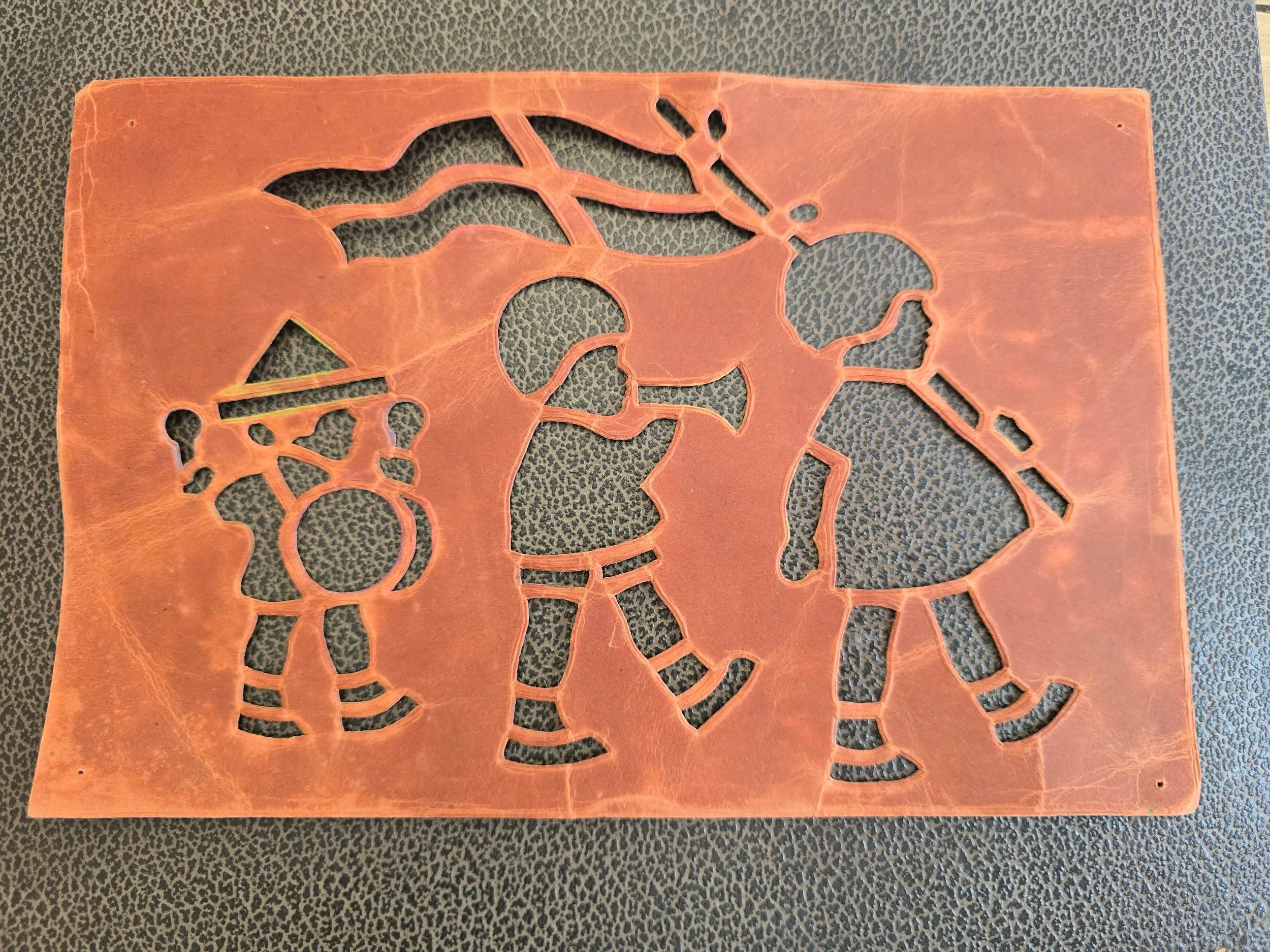 Assortment of vintage British-style card stencils featuring children, birds, flowers and geometric designs, with original paint traces and wear.