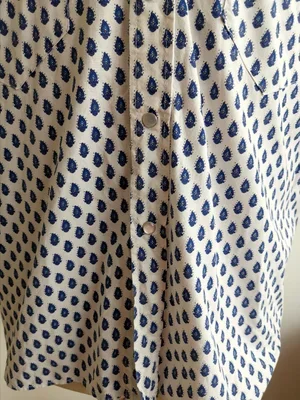 Blue on white paisley Provençale cotton fabric close-up.