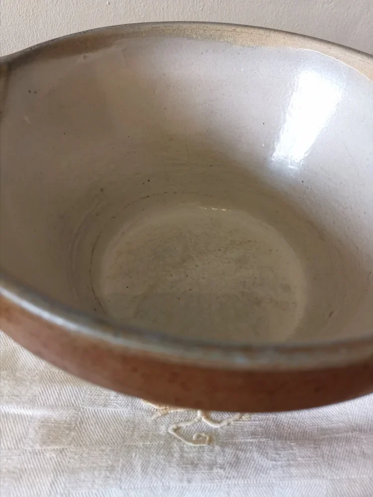 Interior view of vintage French stoneware bowl with biscuit glaze