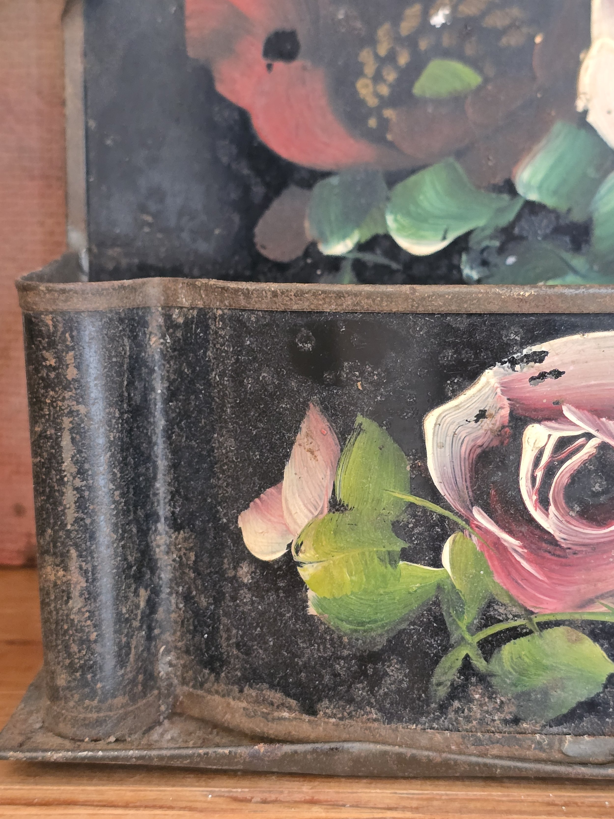 Early 20th century floral wall pocket with hand painted roses and original aged finish.