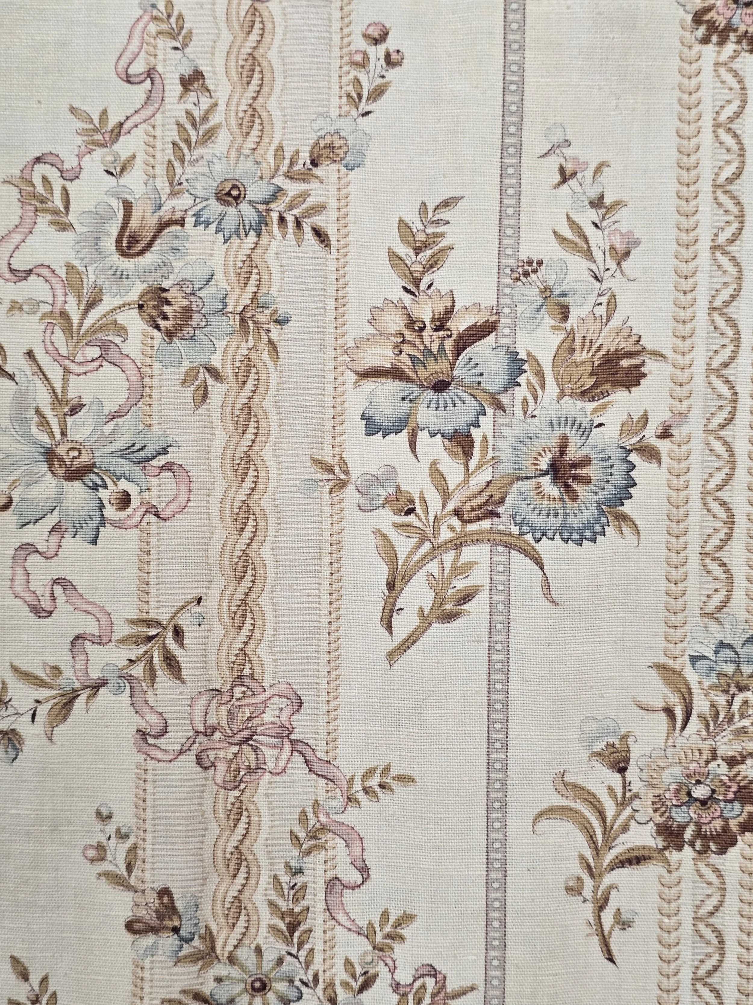 Antique French furnishing fabric showing its natural woven ground and gentle age