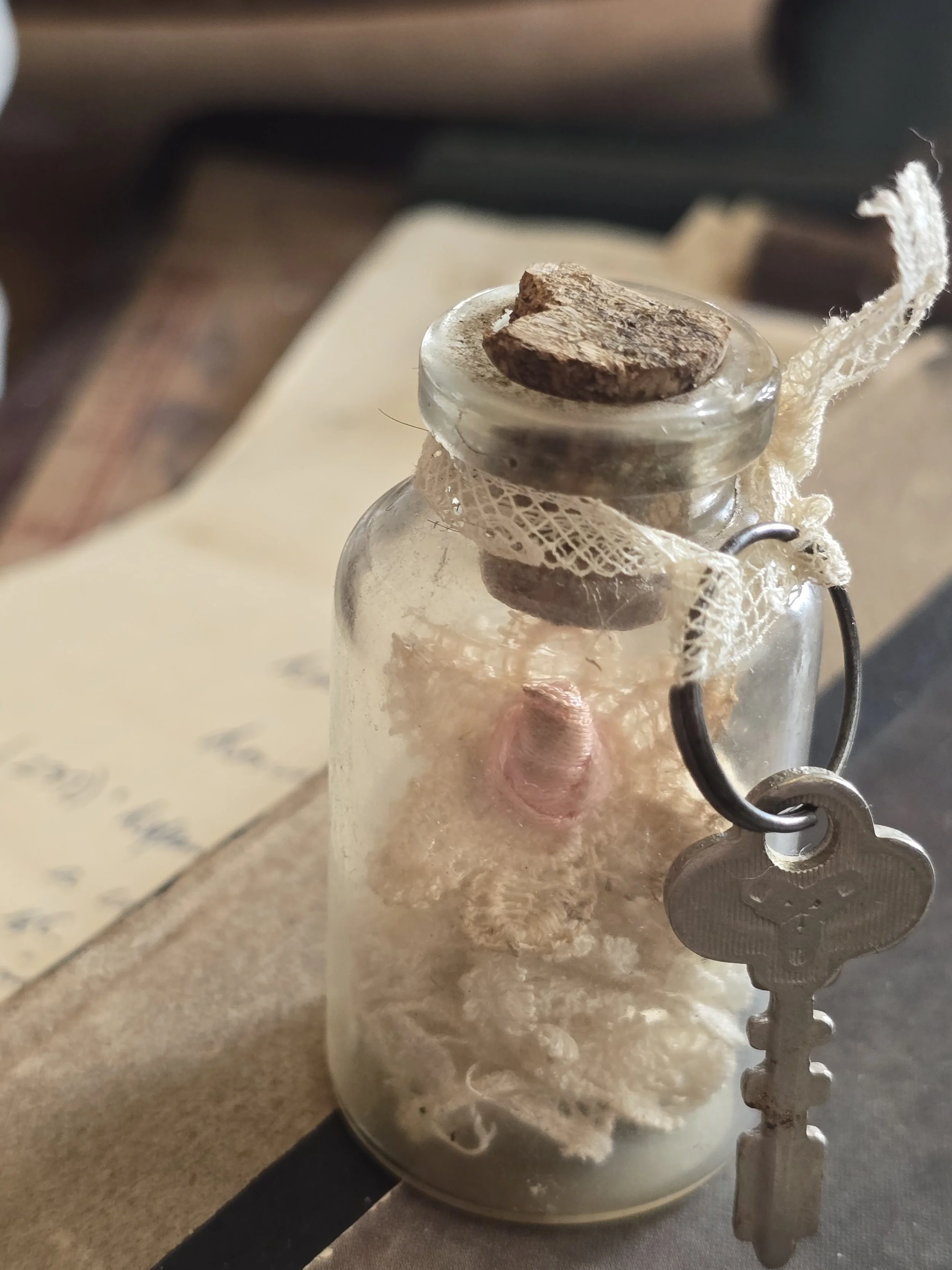 Small curiosity bottle with timeworn antique materials