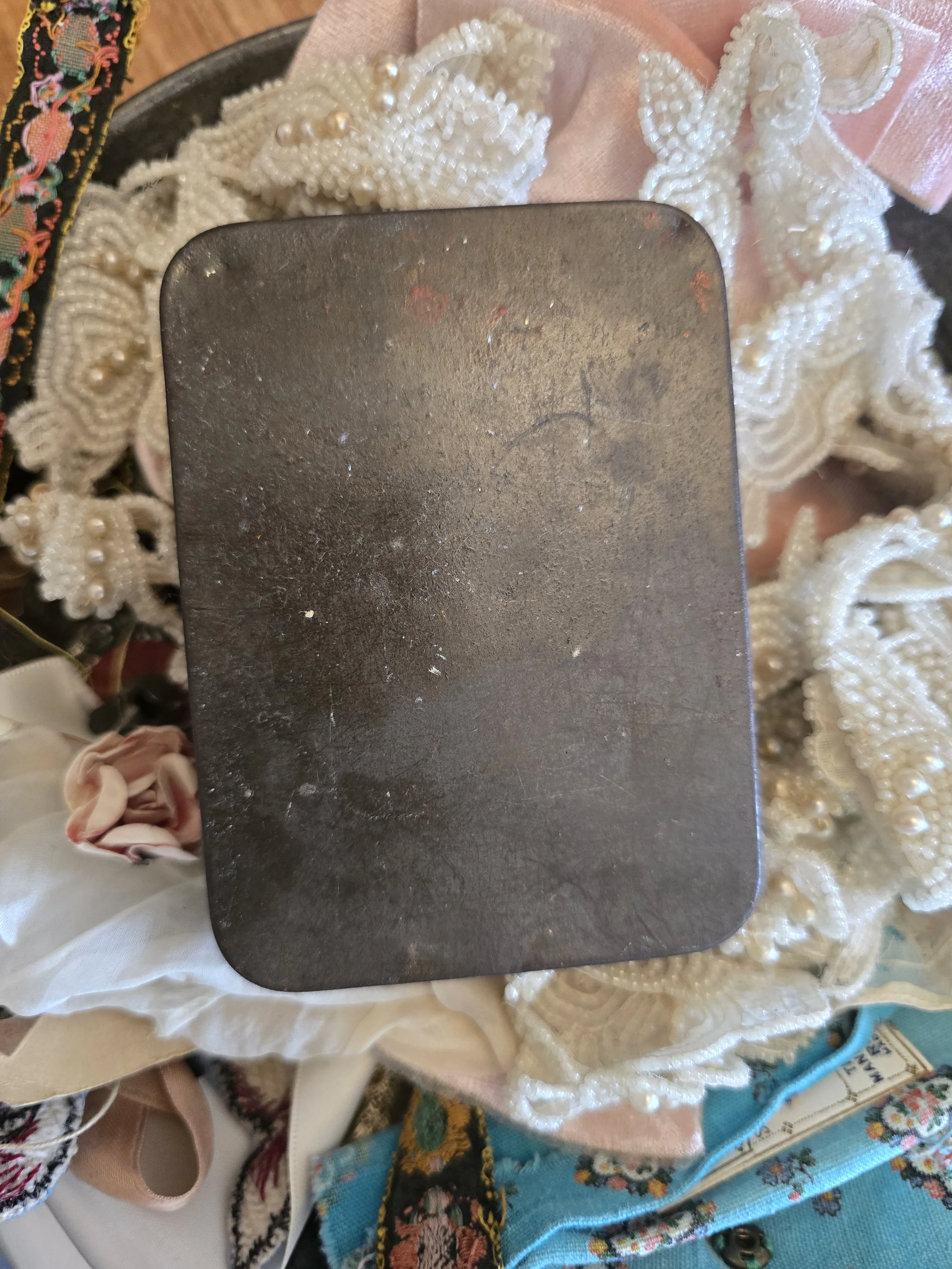 Studio Made portrait tin featuring a found antique image reproduced in soft faded mauve and sepia tones.