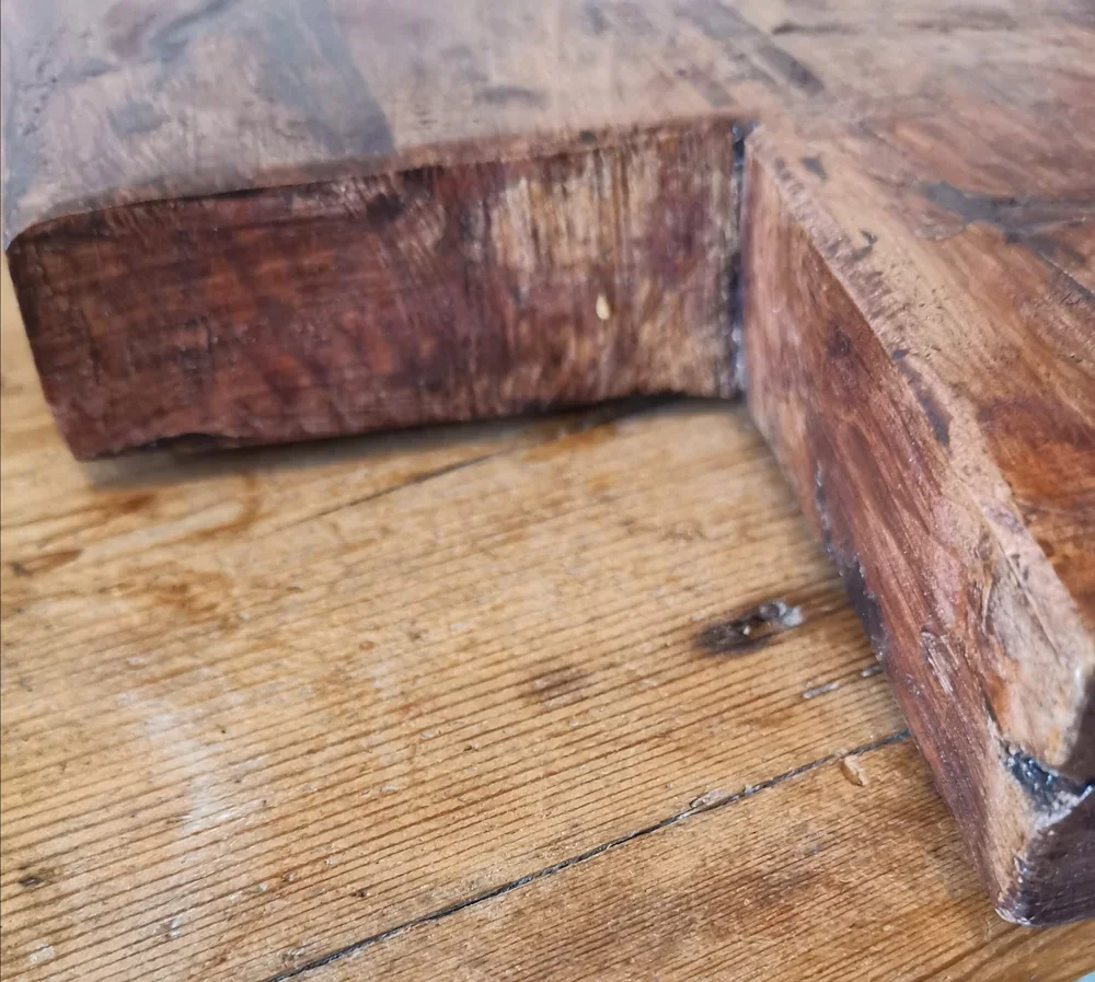 Rustic French oak cutting board aged surface with darkened character marks