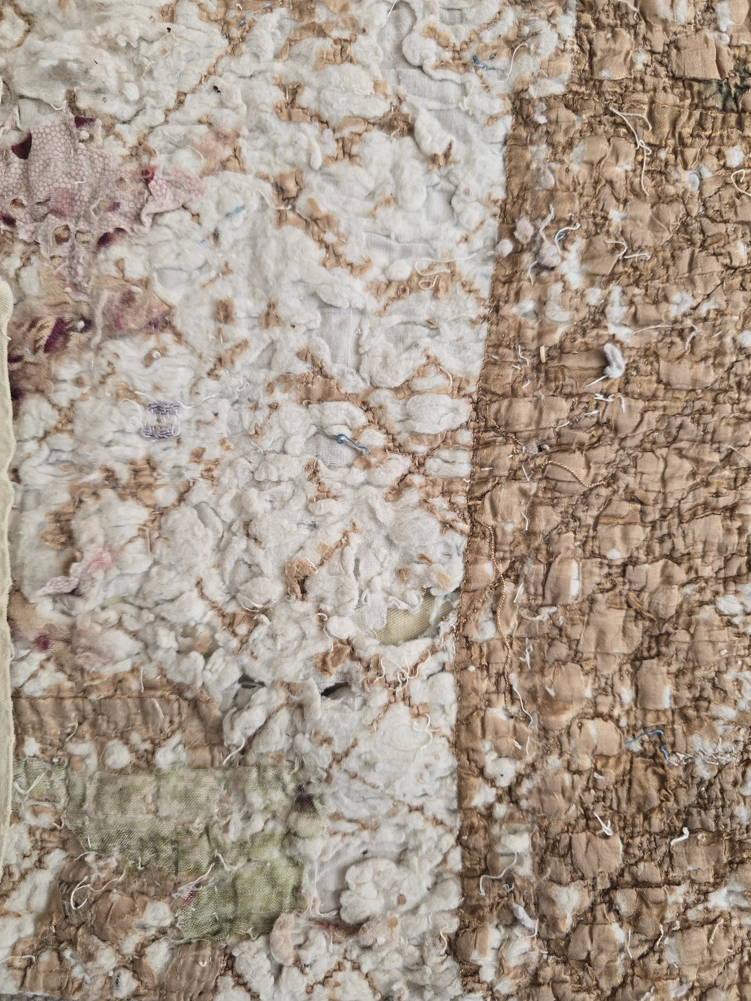 1Antique French quilt fragment with faded purple printed cotton and exposed layers