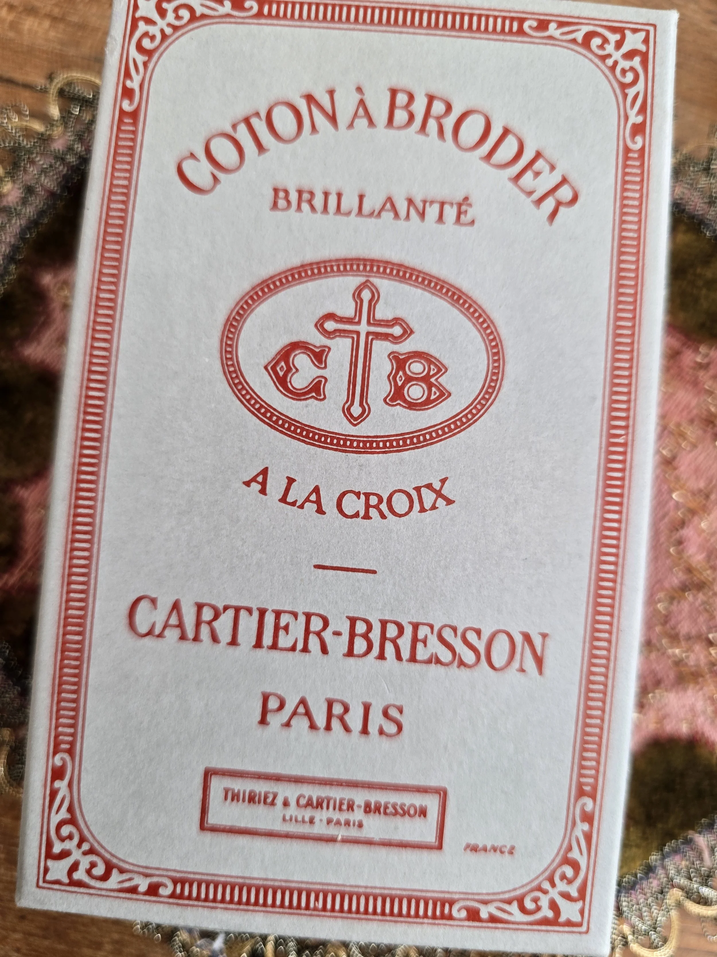 Original Cartier-Bresson À La Croix French embroidery thread box with curated vintage sewing treasures and haberdashery supplies.