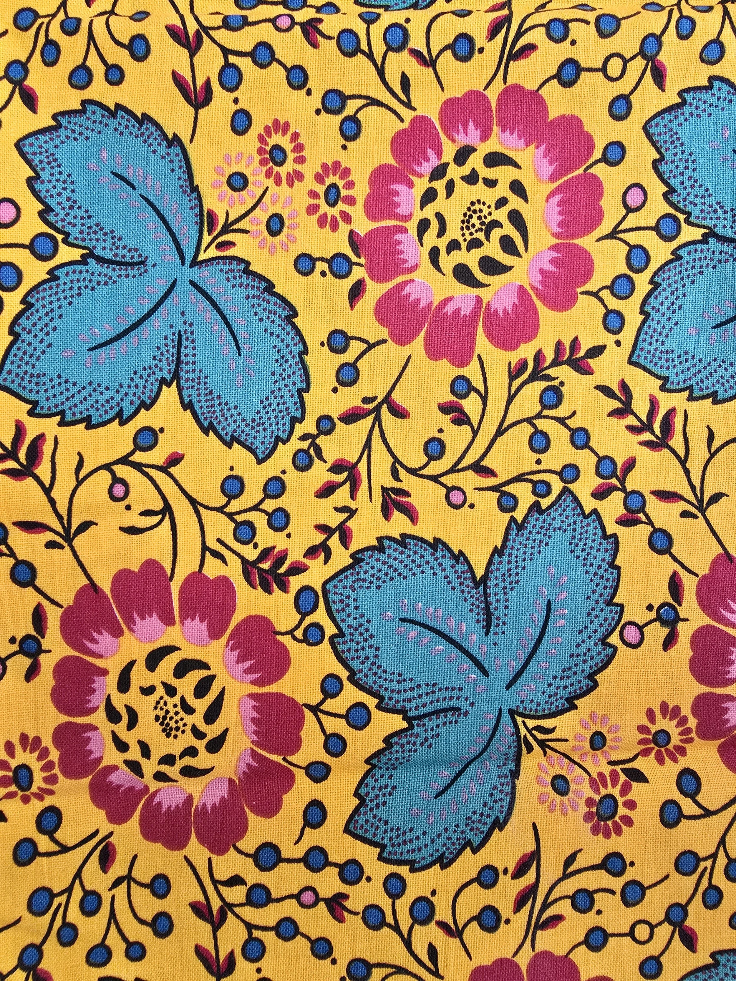 Close-up of Habitat Souleiado Collection label on vintage yellow floral cotton napkins