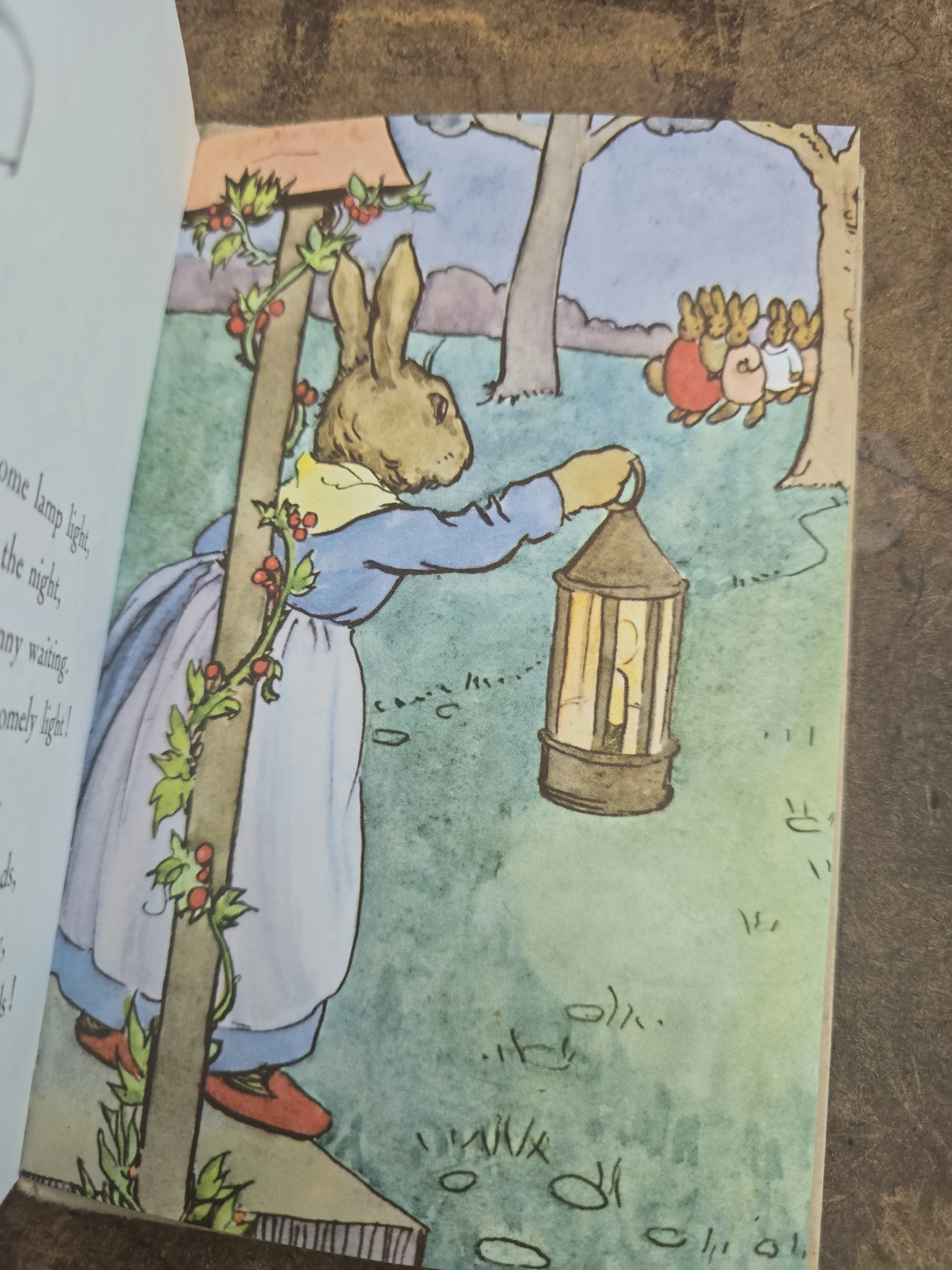 Rabbit carrying lantern in evening scene from Bunnikin's Picnic Party.