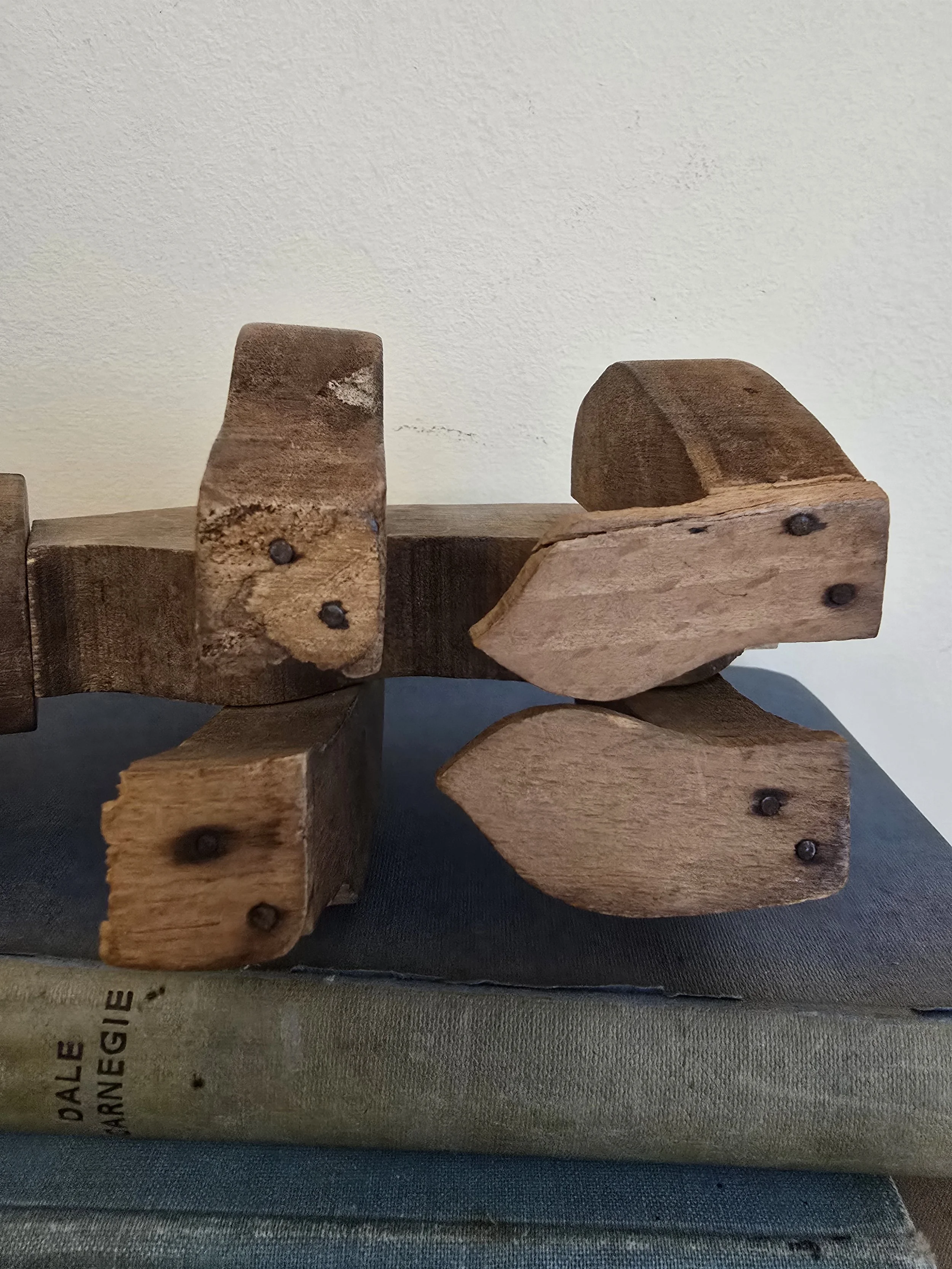 Underside view of antique articulated bear showing nail joints and construction details