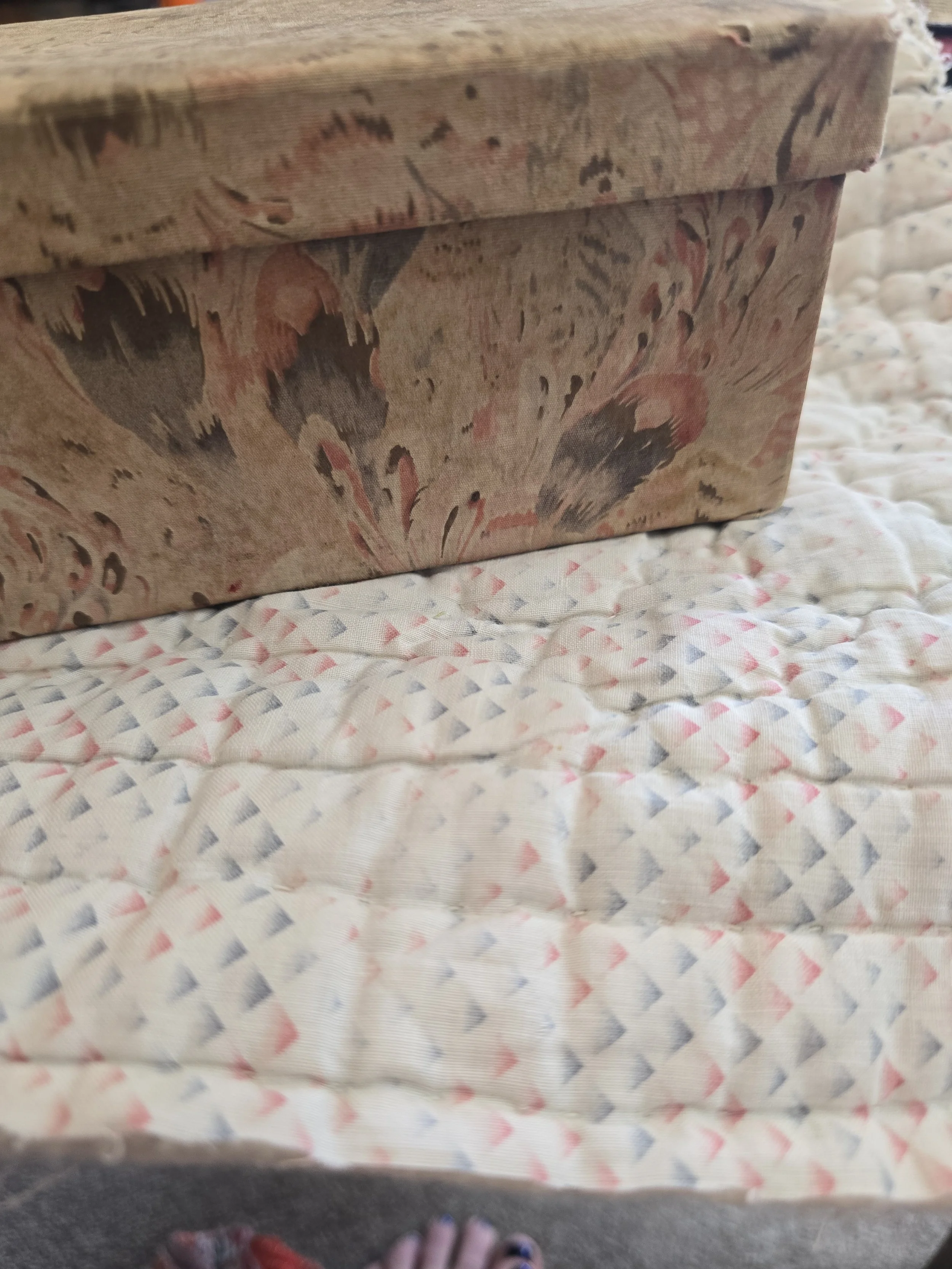Quiet Edit storage box with age-softened textile covering and removable lid.