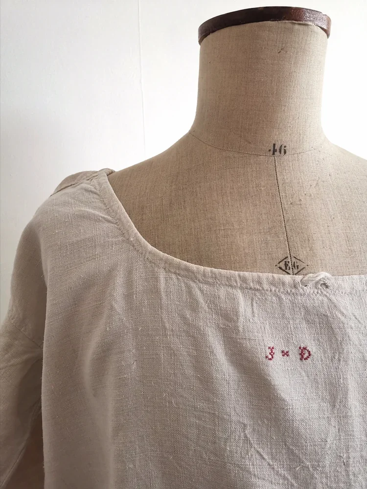 Drawstring neckline detail of antique French chemise de nuit, 1890s