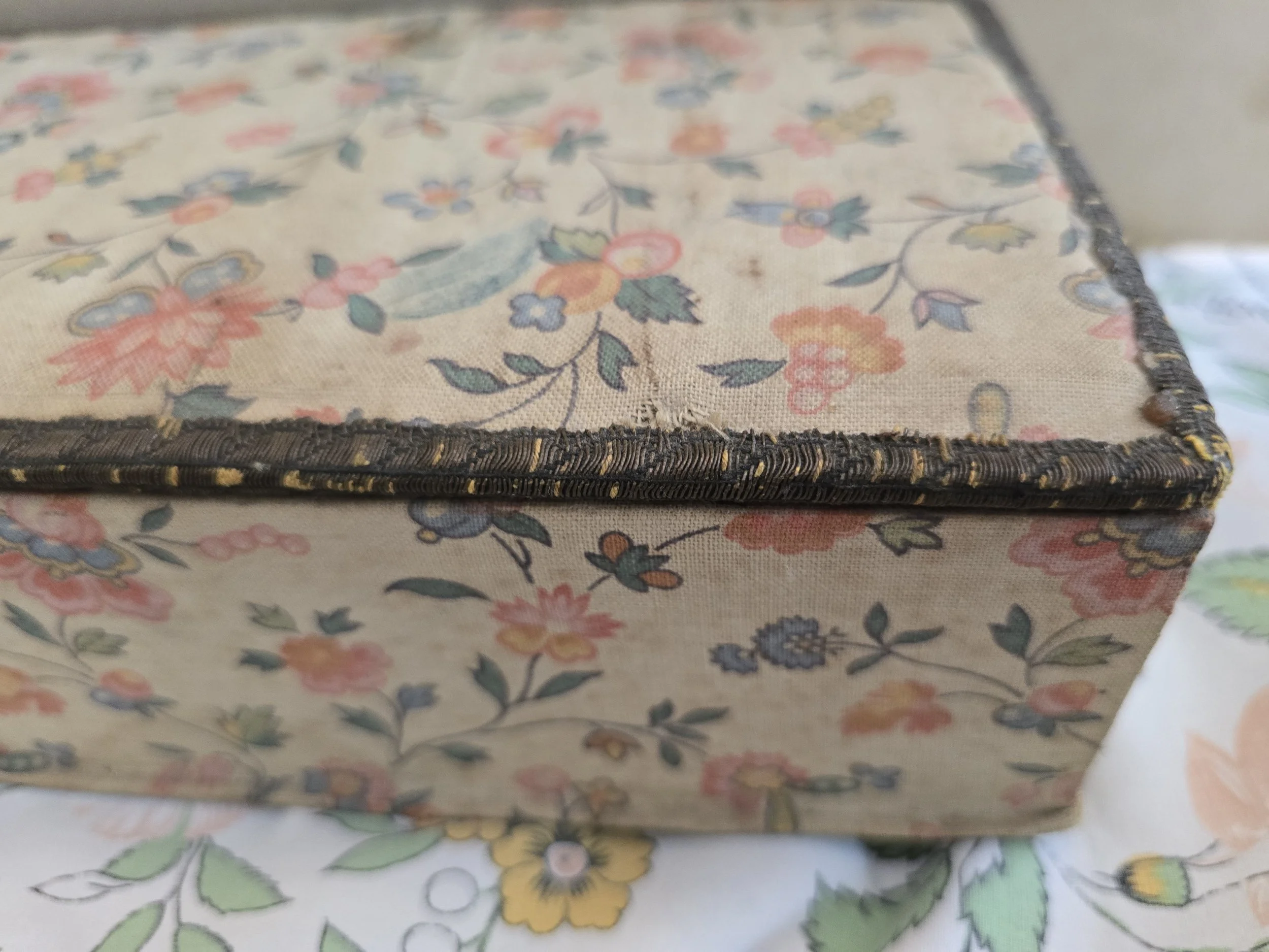 vintage floral fabric covered box with softly faded cotton print