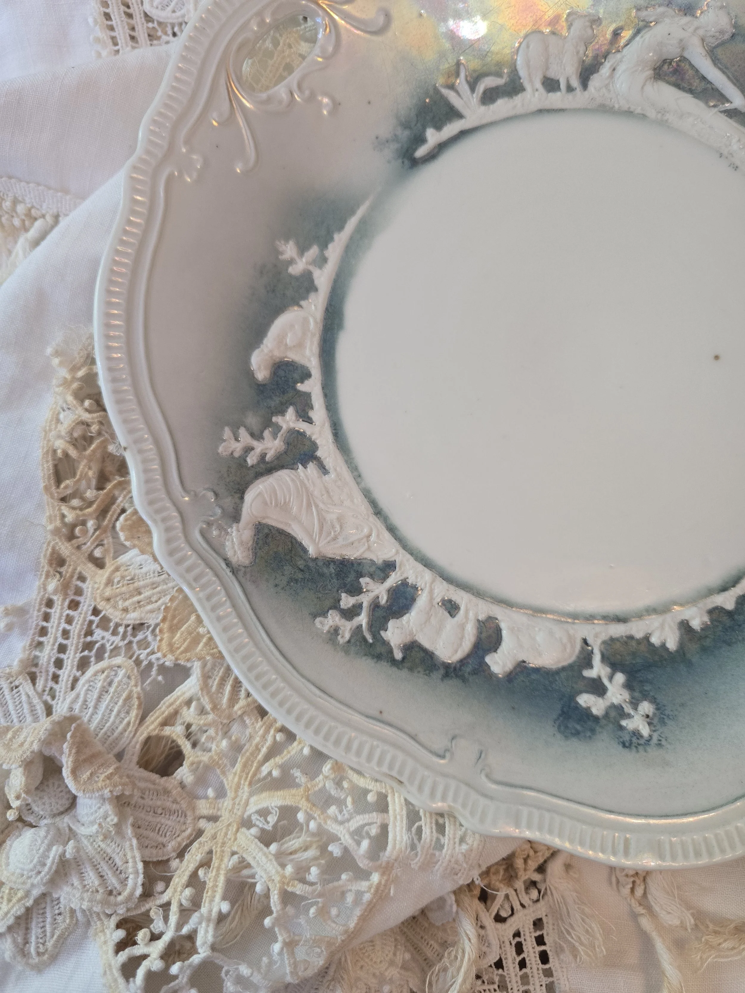 Vintage German iridescent lustre ware plate with raised pastoral figures and sheep
