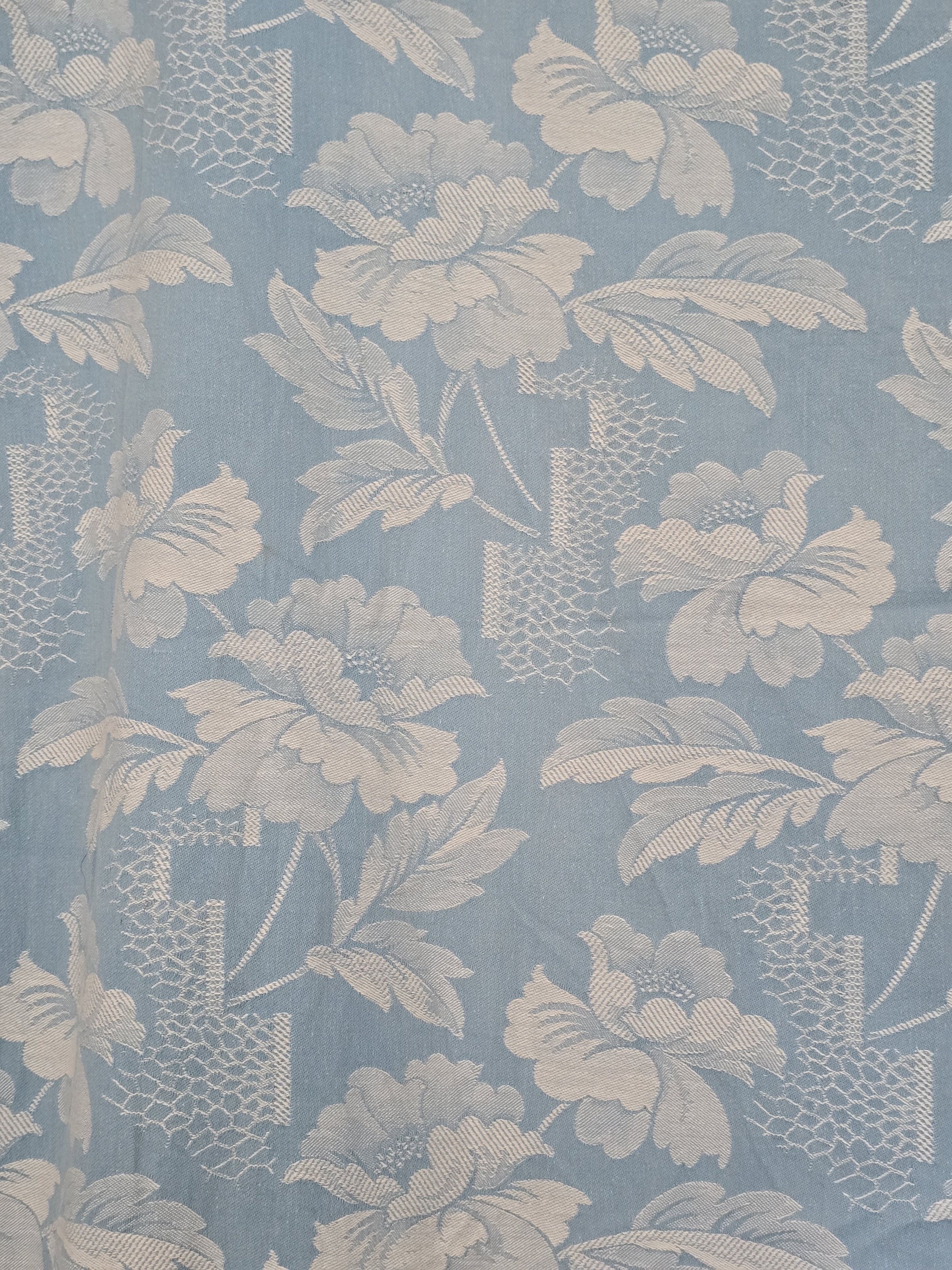 Detailed texture of 1940s floral coutil with visible woven florals