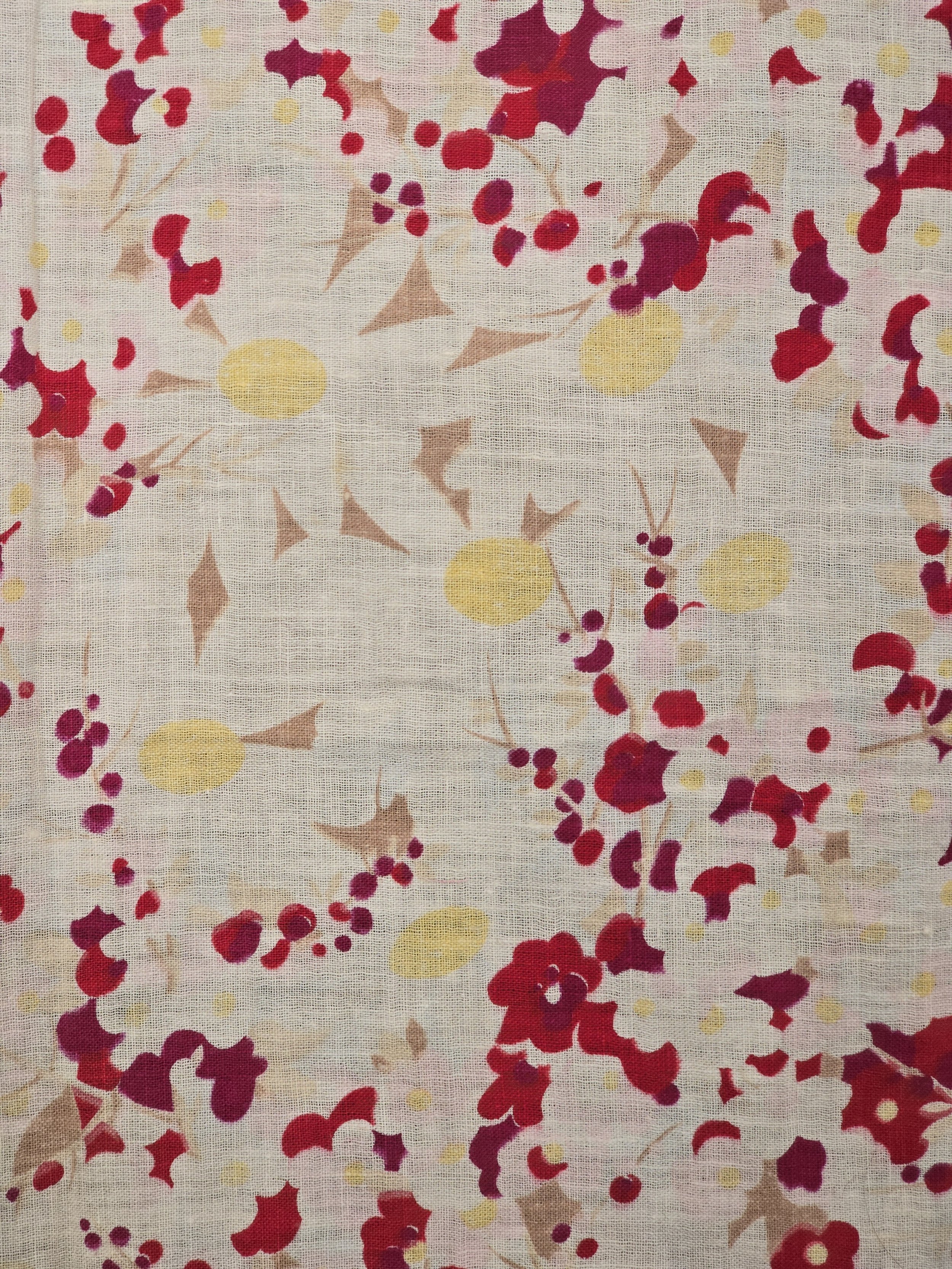 Close-up of red and yellow floral print on fine vintage cotton