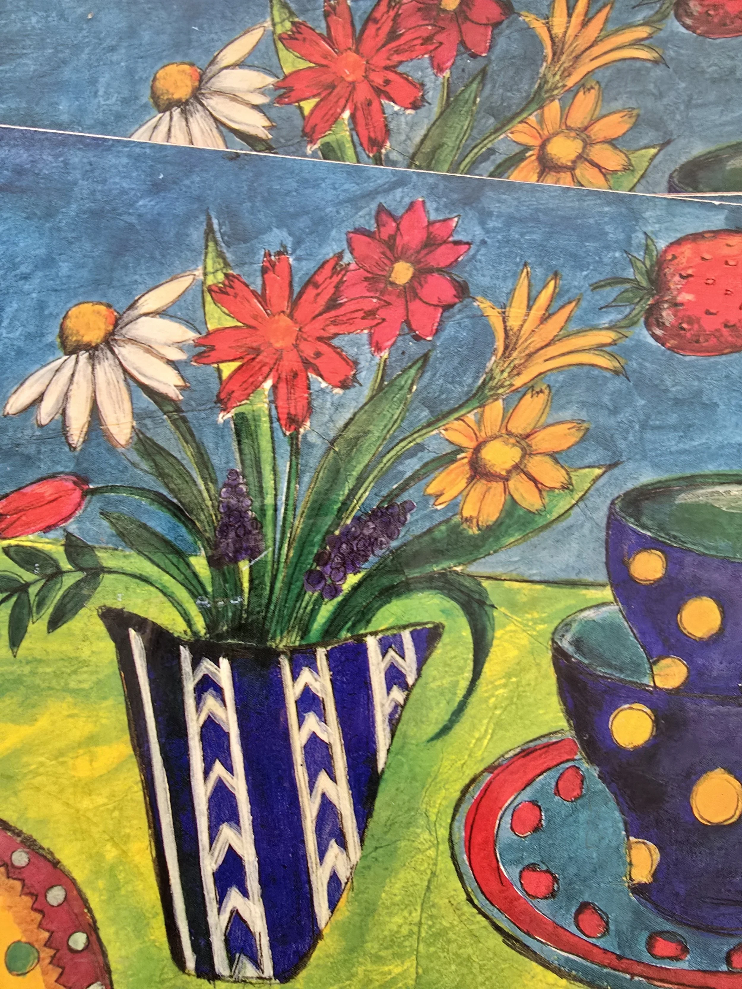 Close-up of vintage placemats with strawberries and floral illustrations