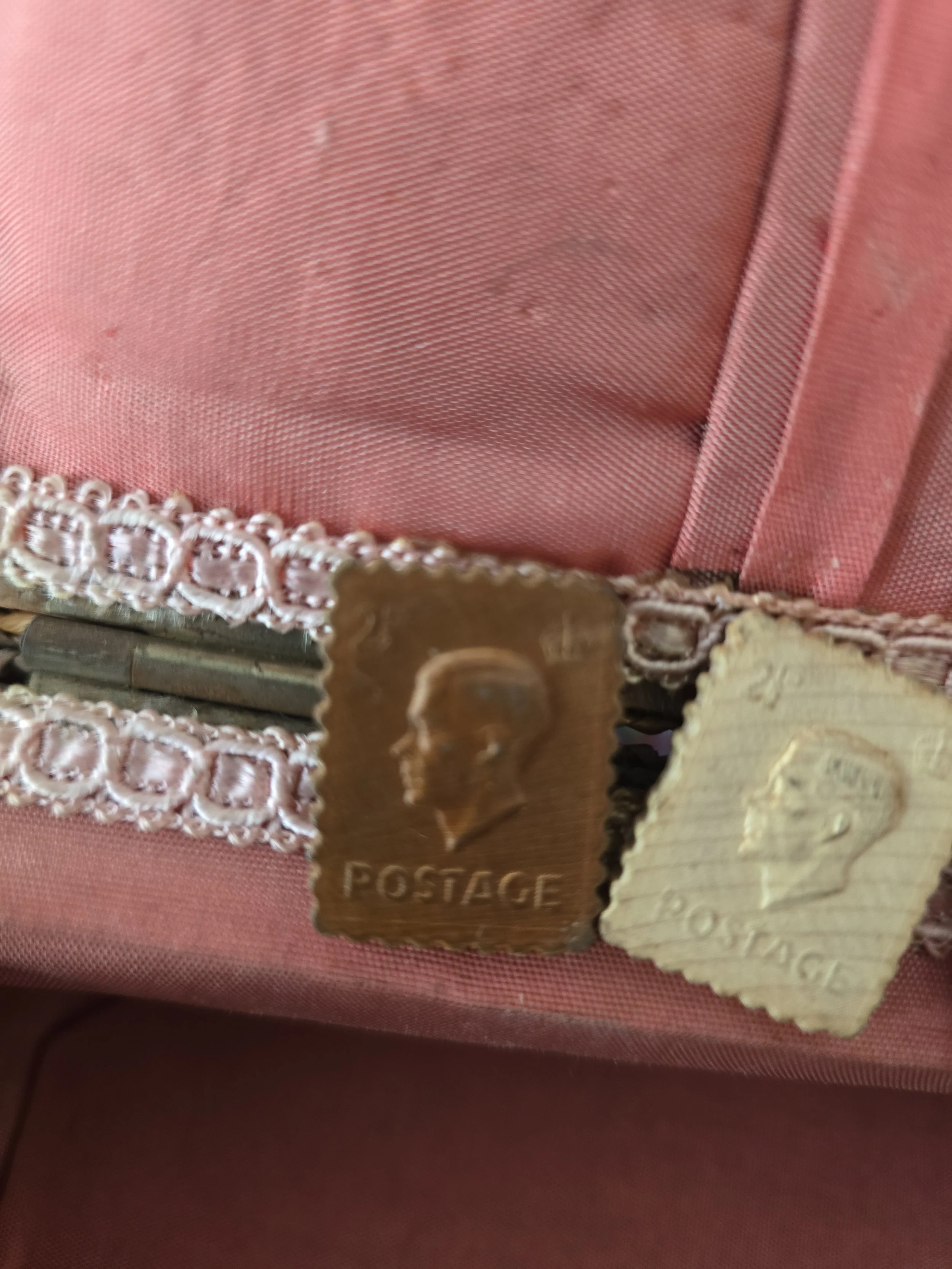 Close-up of King George VI moulded novelty buttons.