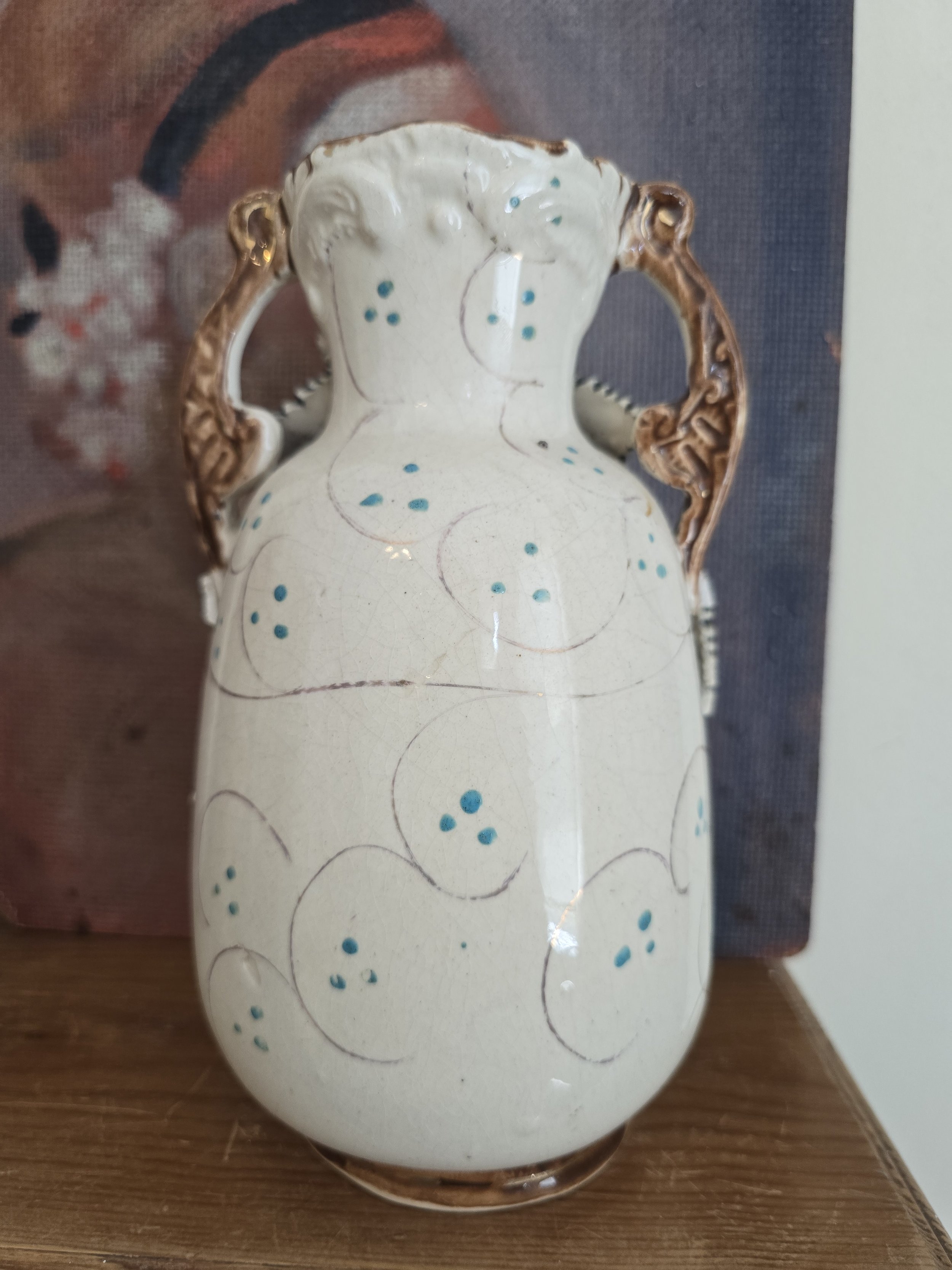 reverse of decorative ceramic vase showing age-related wear
