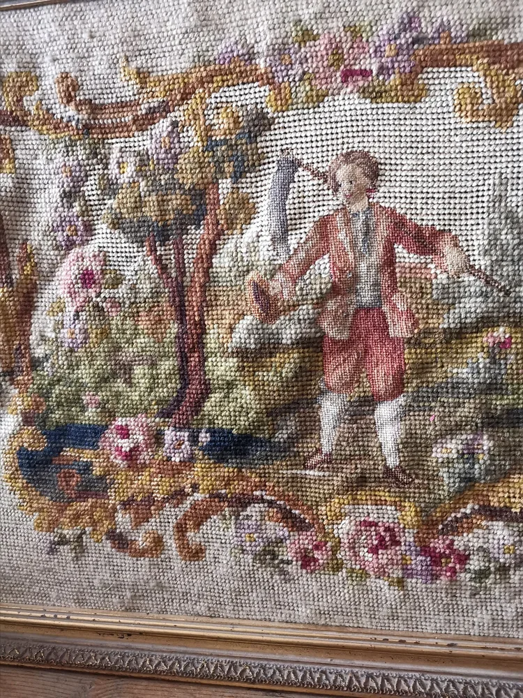 Centre view showing harvest figure surrounded by floral vines and countryside