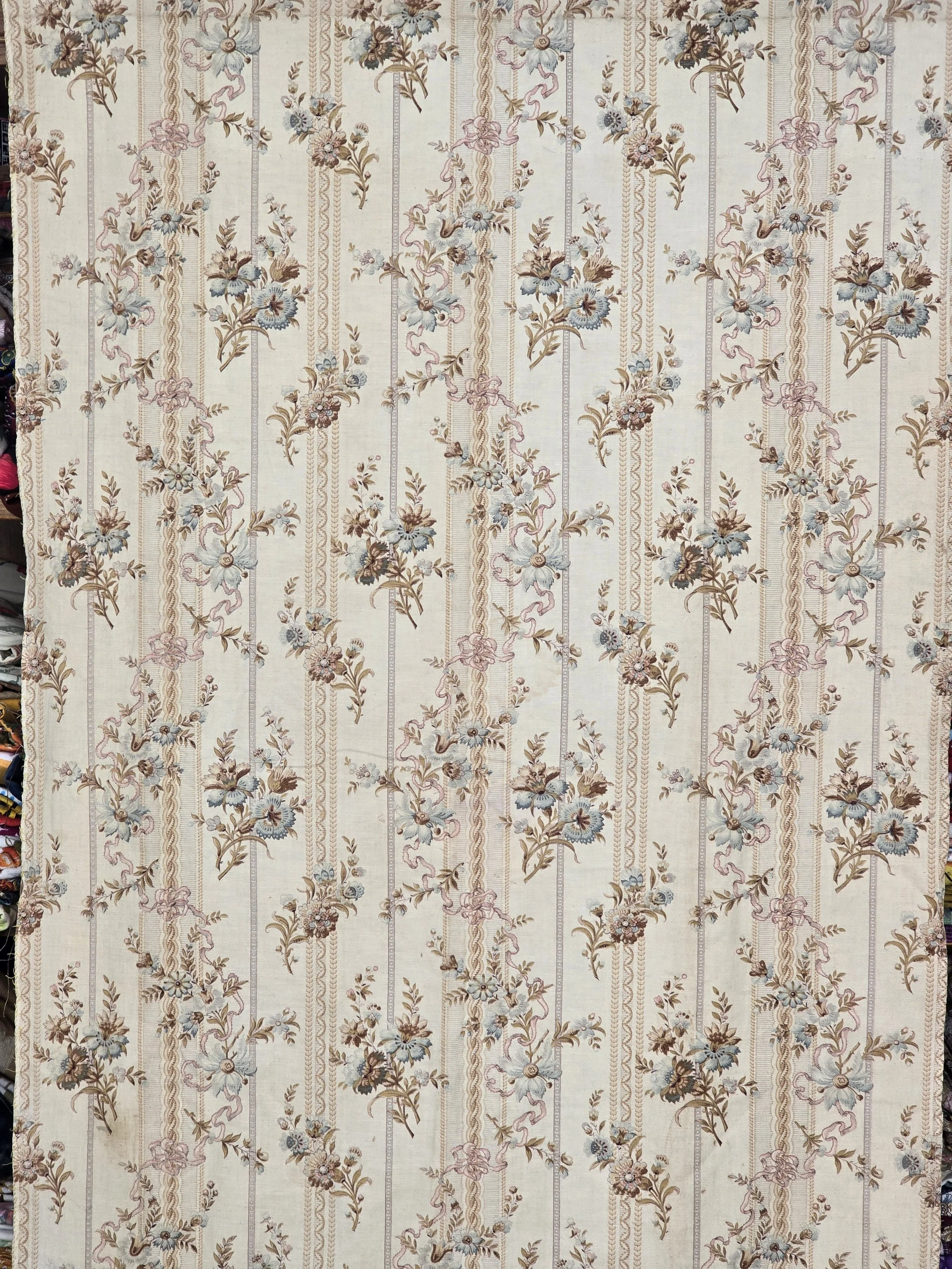 Antique French floral furnishing fabric with faded blue pink and brown flowers