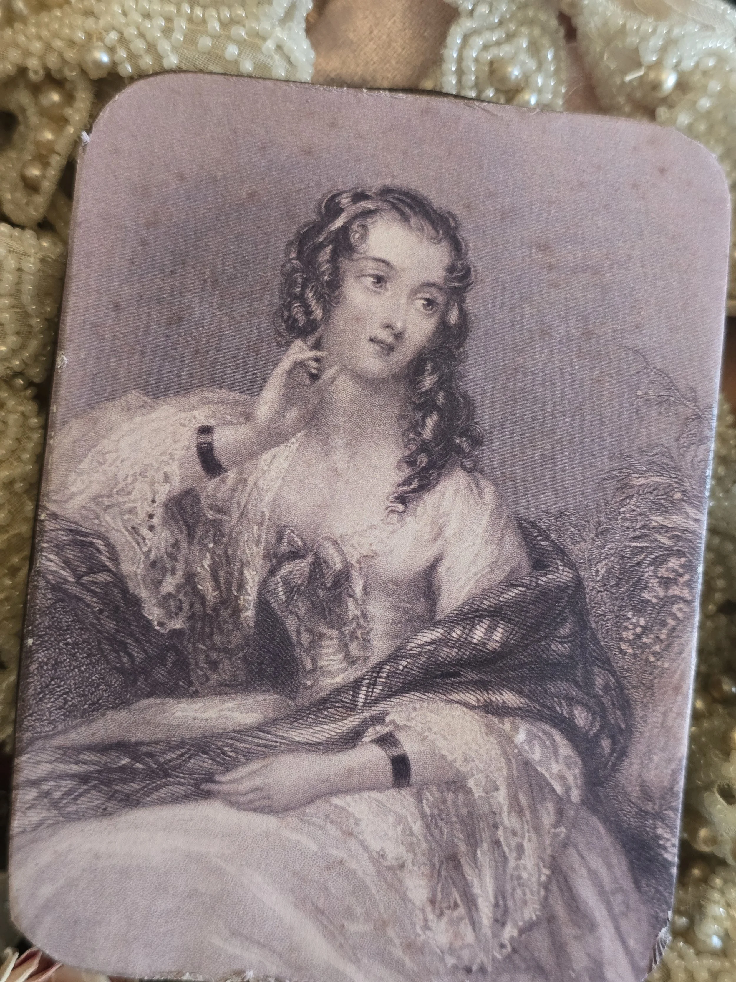 Reverse of Studio Made vintage portrait tin showing the original dark metal with scratches and age-related wear.