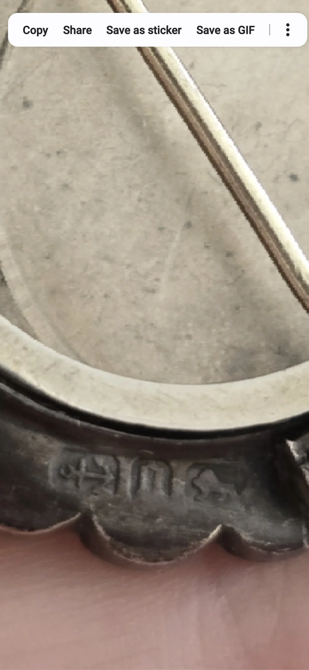Victorian era silver brooch pendant designed to hold a photograph or keepsake.