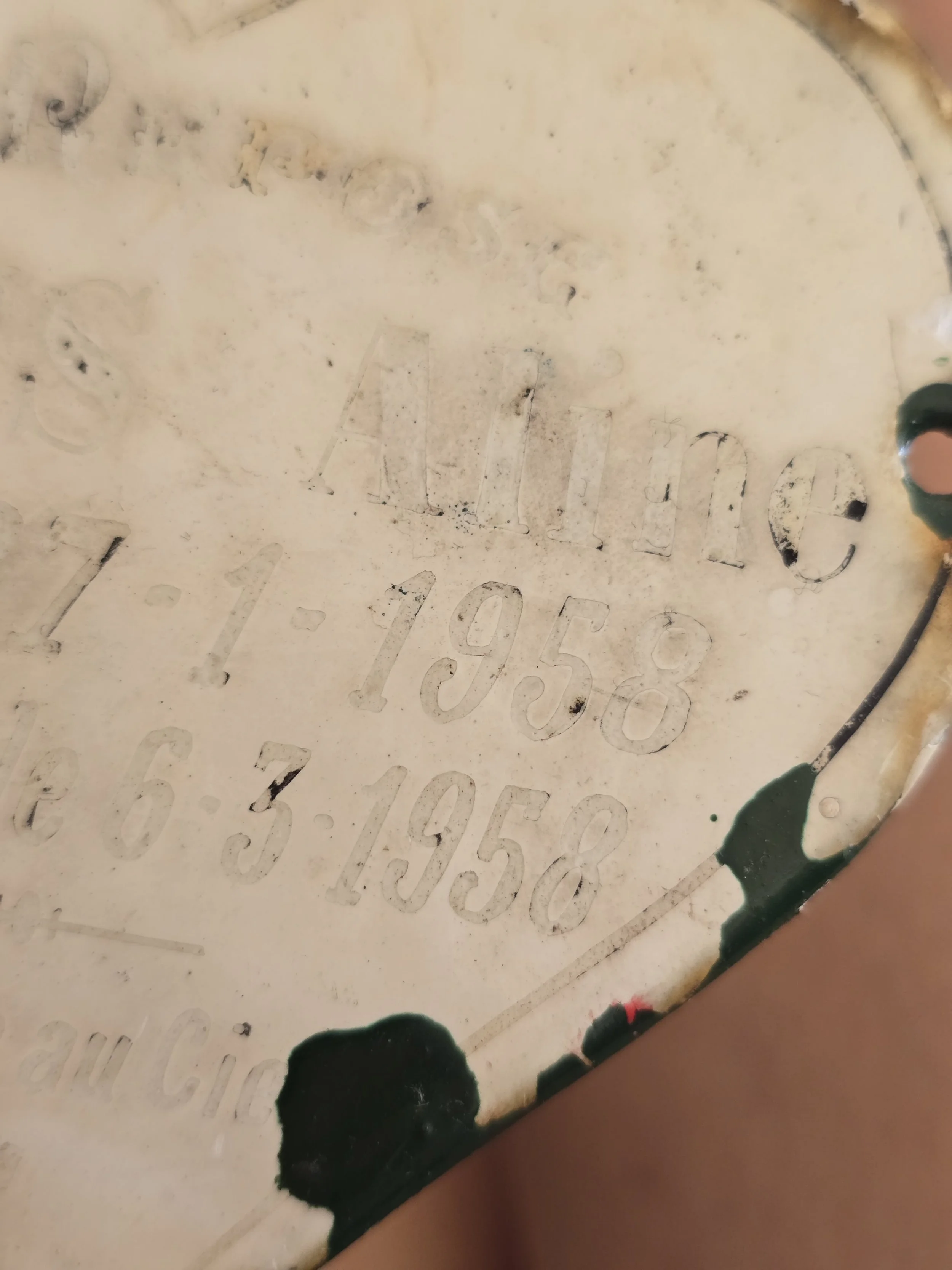 Detail of Anne's 1953 and 1958 dates on French enamel plaque