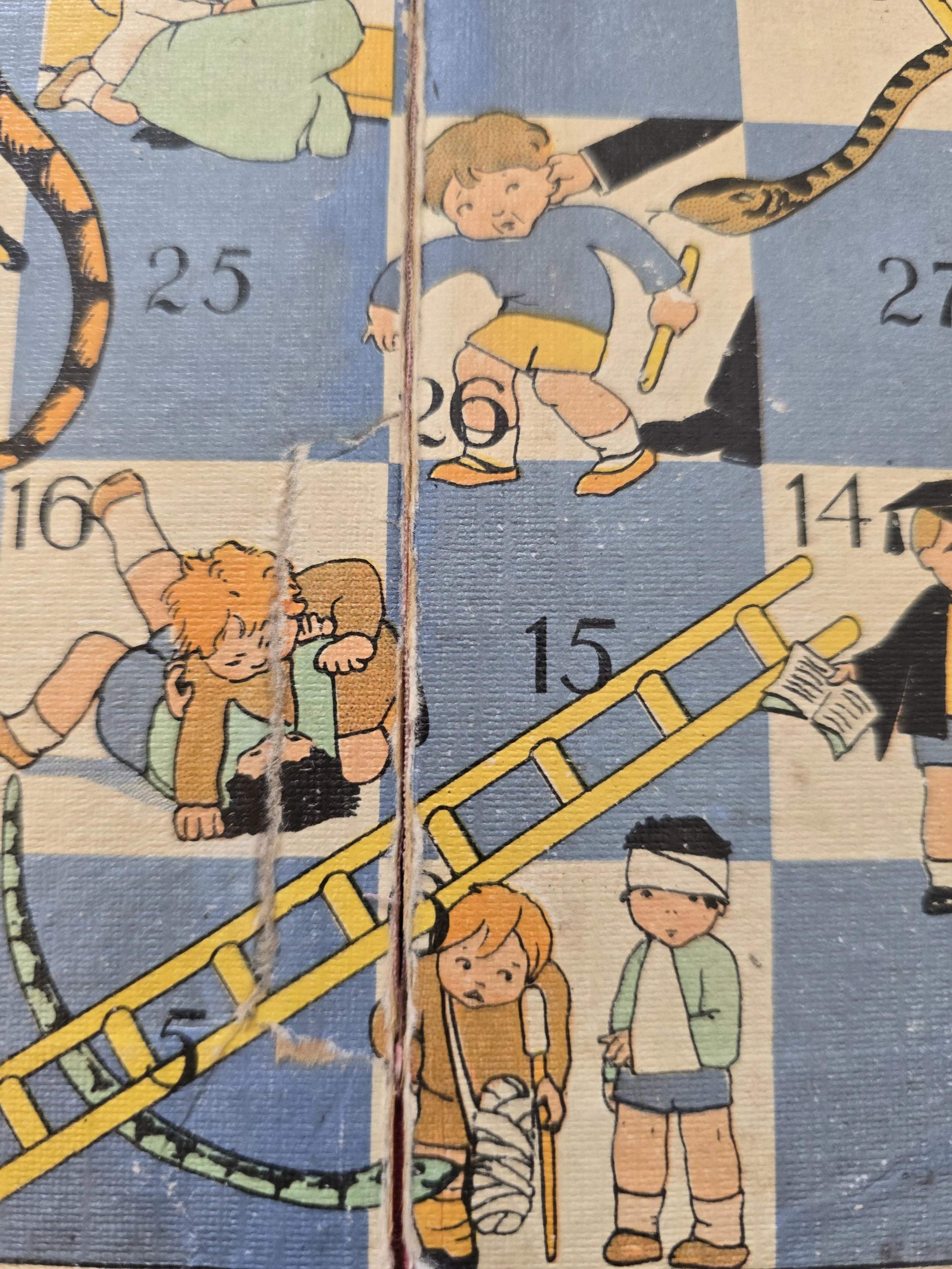 Detail of black cat and child climbing a ladder on vintage board game