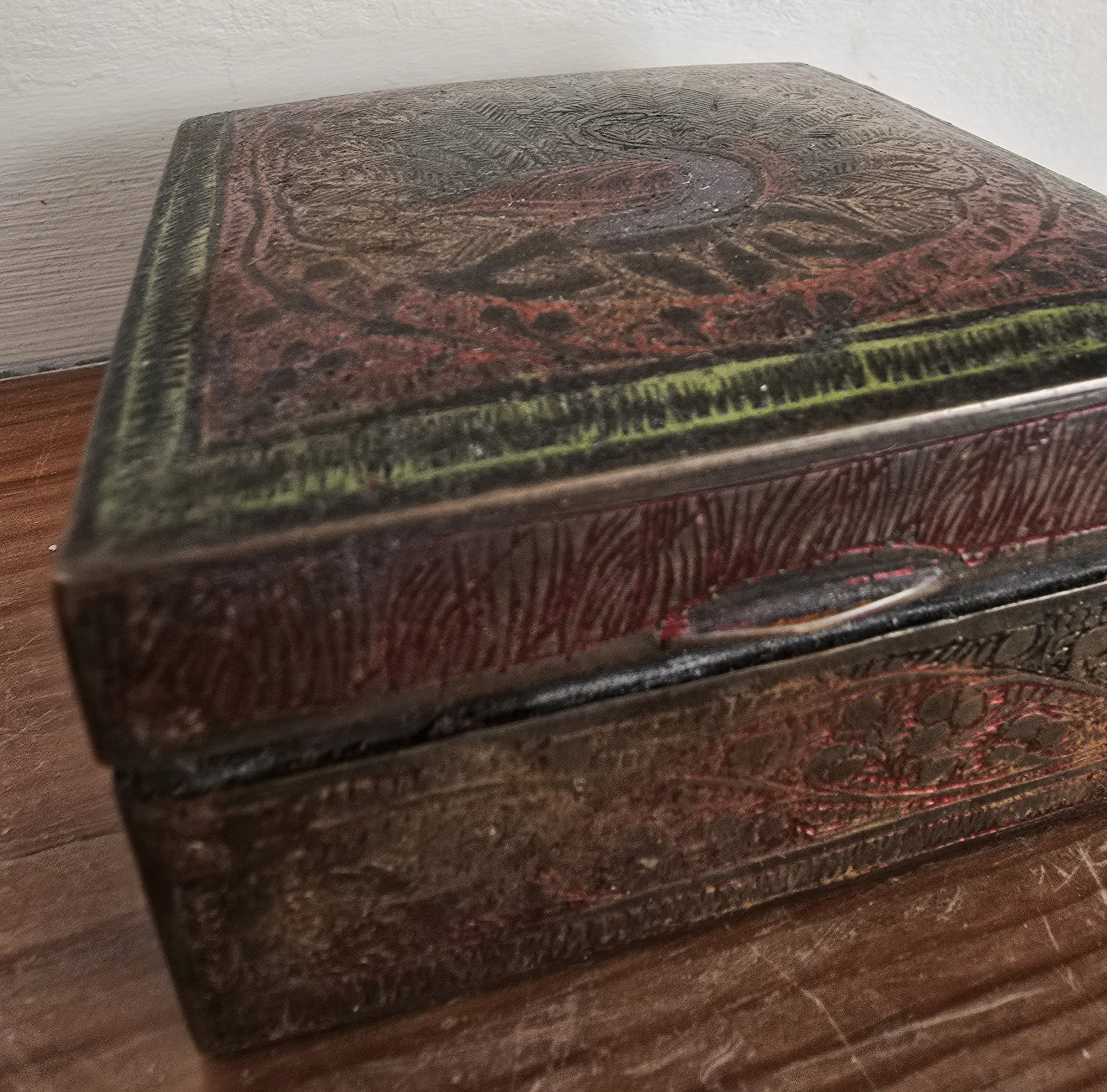 Side view of vintage Indian box showing patina and texture