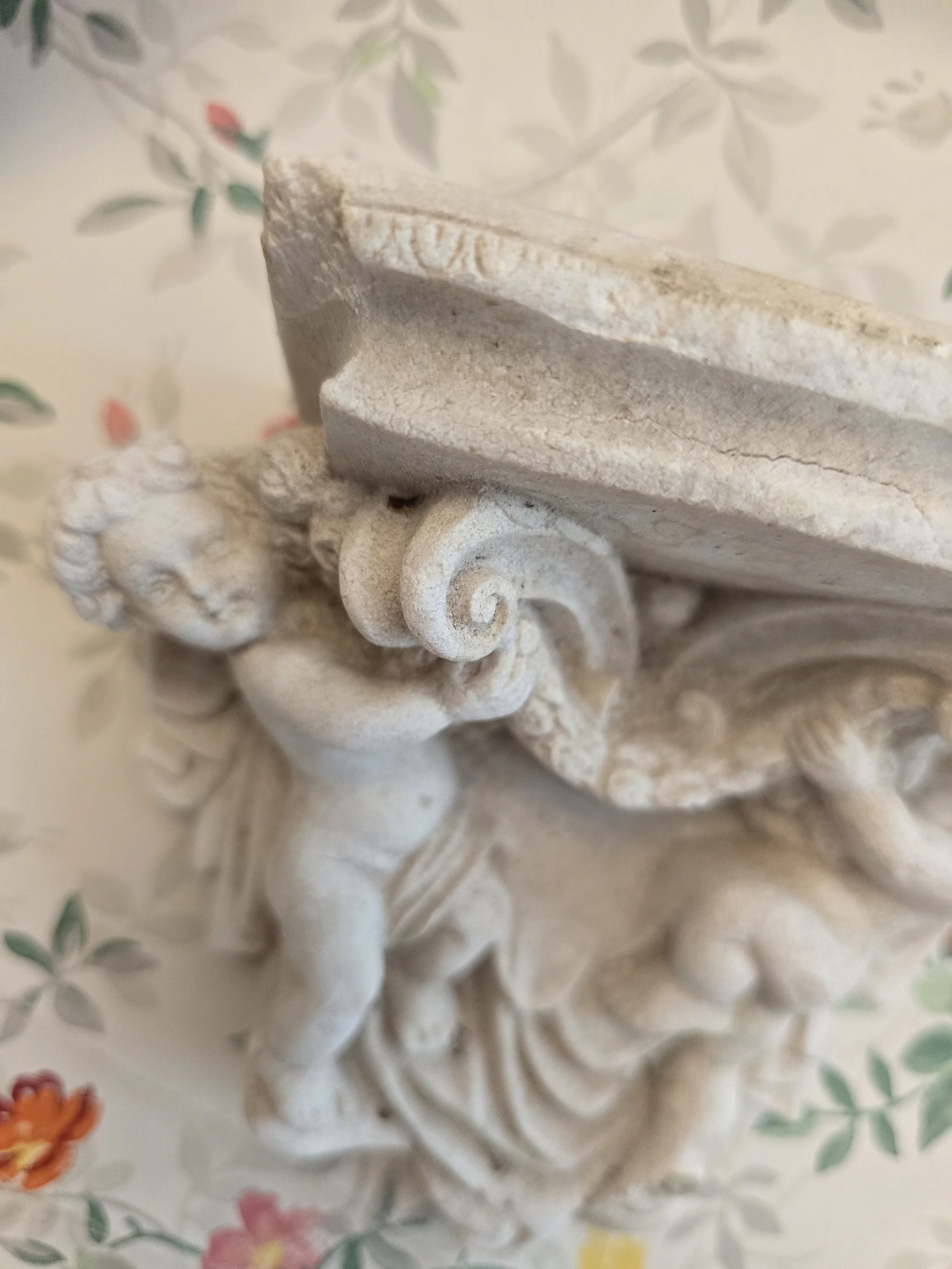 Spine and front cover detail of vintage Coningsby paperback publishWeathered decorative cherub wall corbel with aged stone-effect finish.ed by Signet Classics in 1962