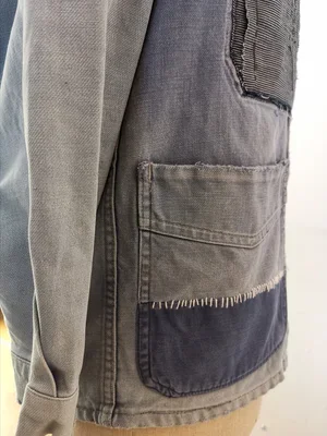 Hand-mended French chore coat with patch and stitch detail