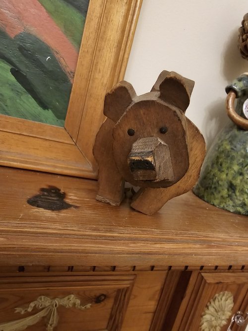 Facial carving detail of carved wooden bear toy attributed to French satirist Caran d’Ache