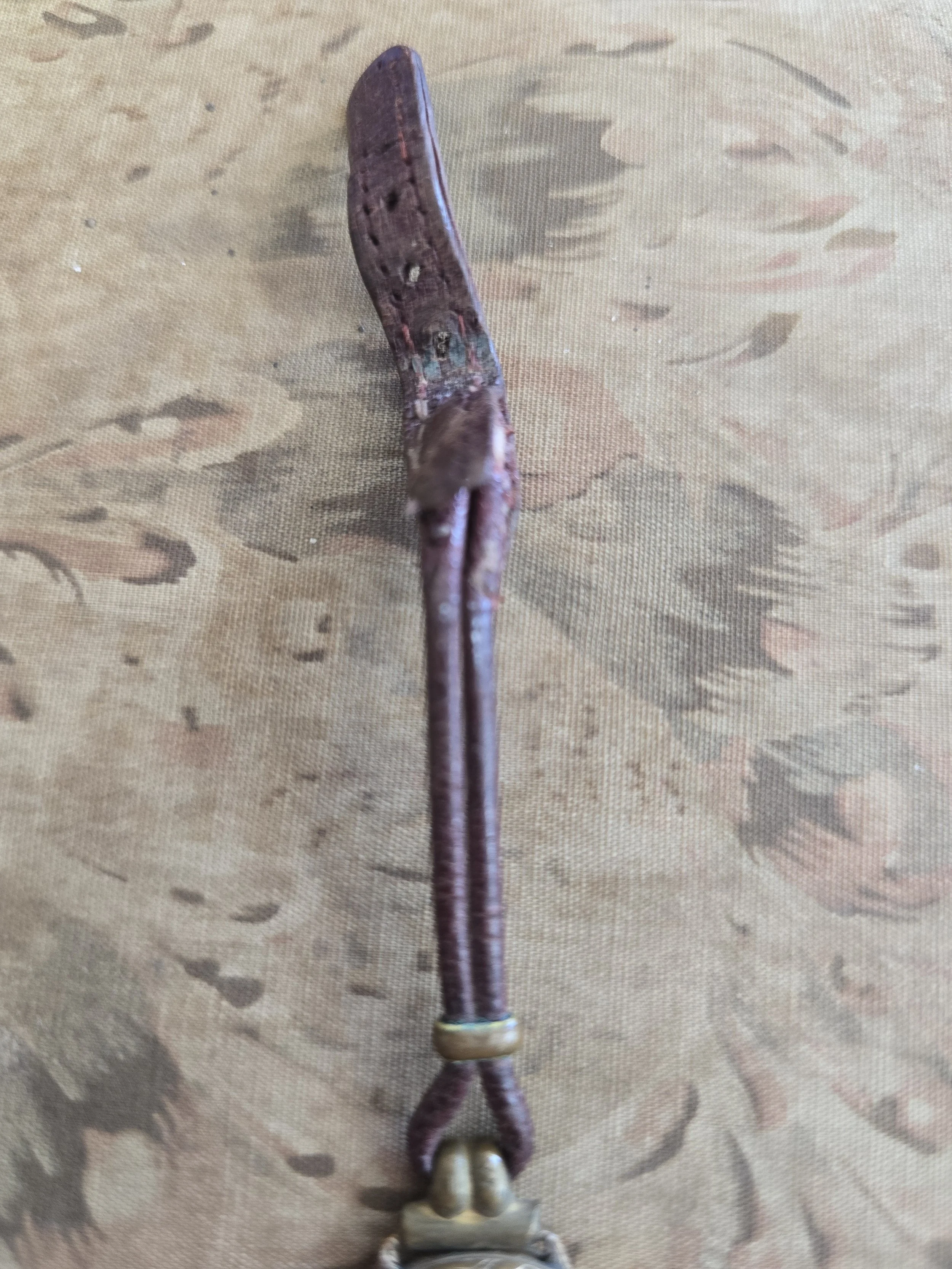 Back of vintage ladies watch showing age-related wear and patina.