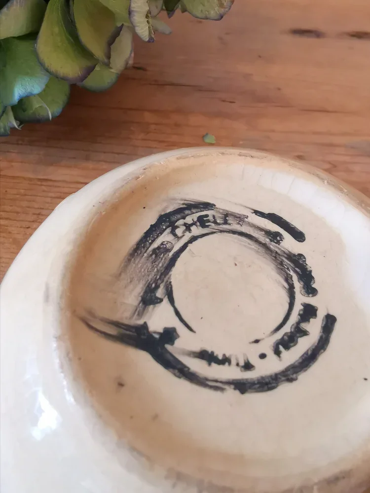 Underside of Tunisian Nabeul bowl with maker’s stamp and aged patina