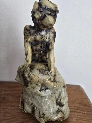 Underside view of ceramic sculpture revealing raw interior texture