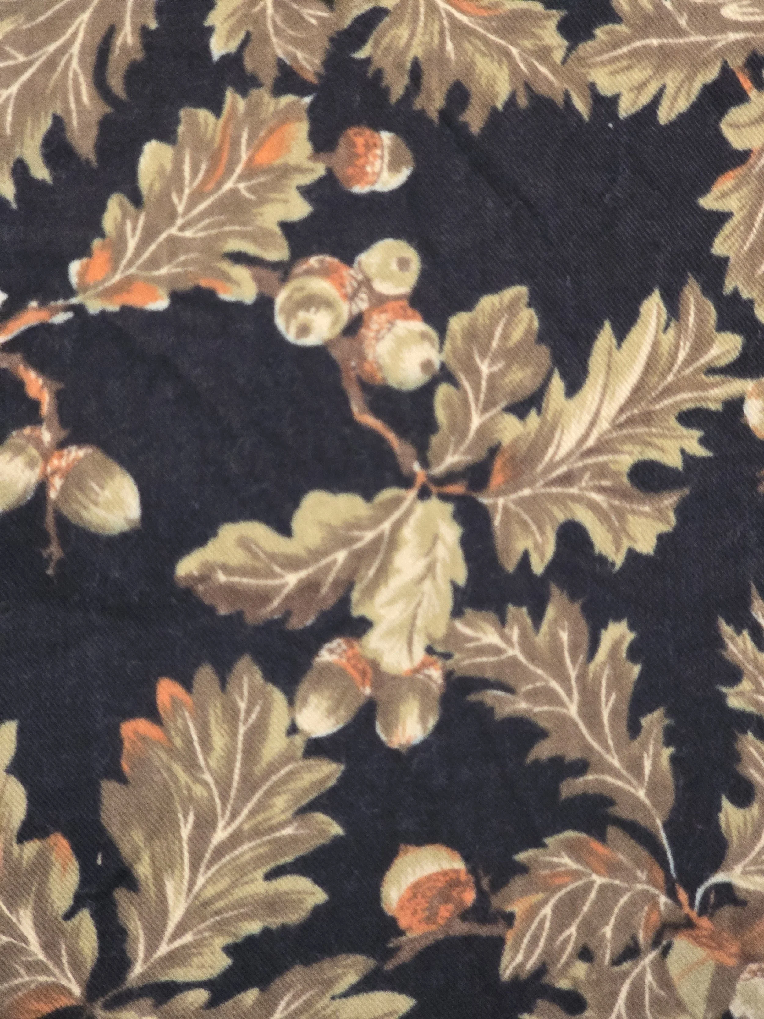 Detailed view of French vintage fabric with naturalistic oak leaves