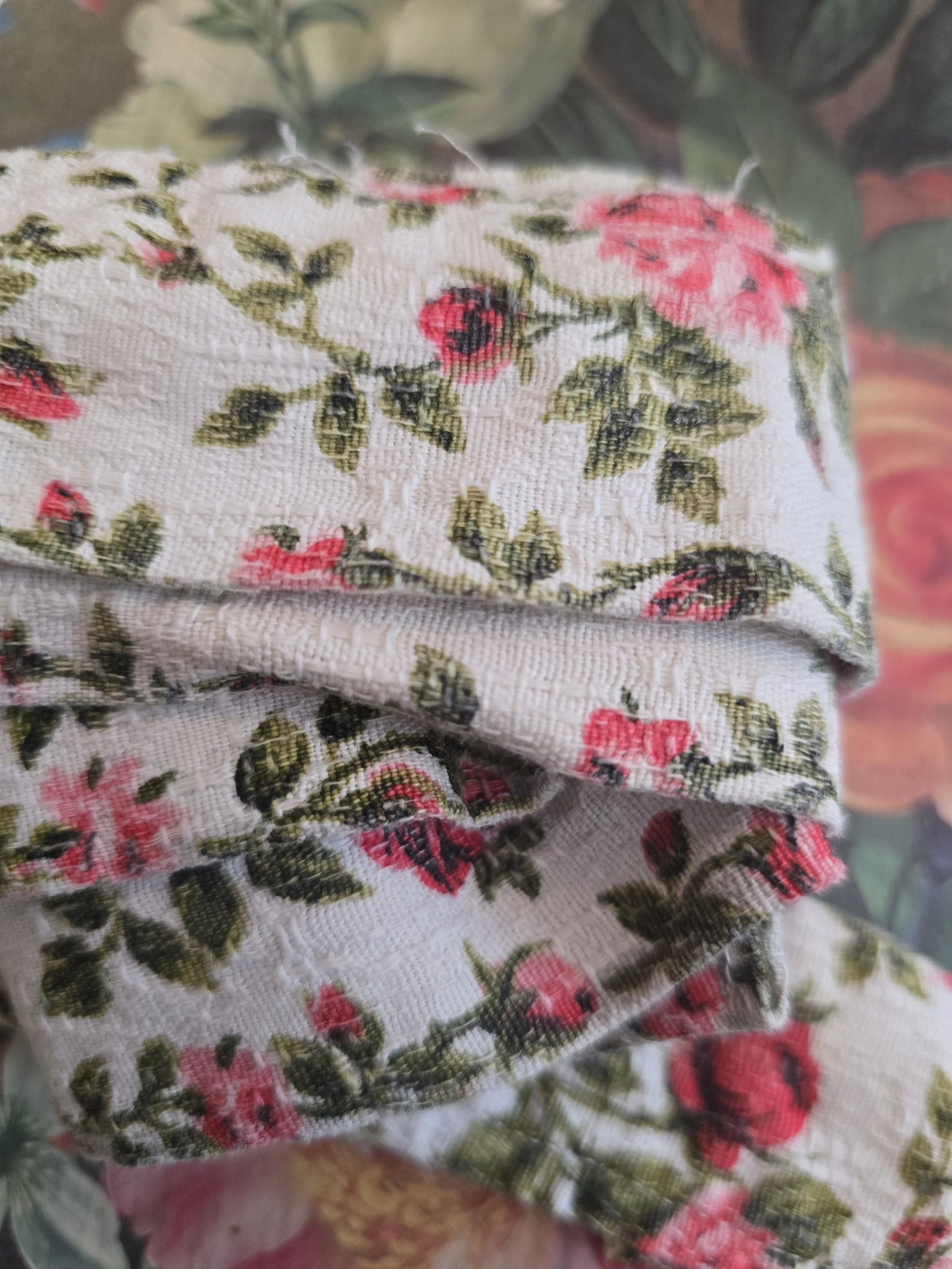 Narrow floral textile fragment salvaged from a French curtain.