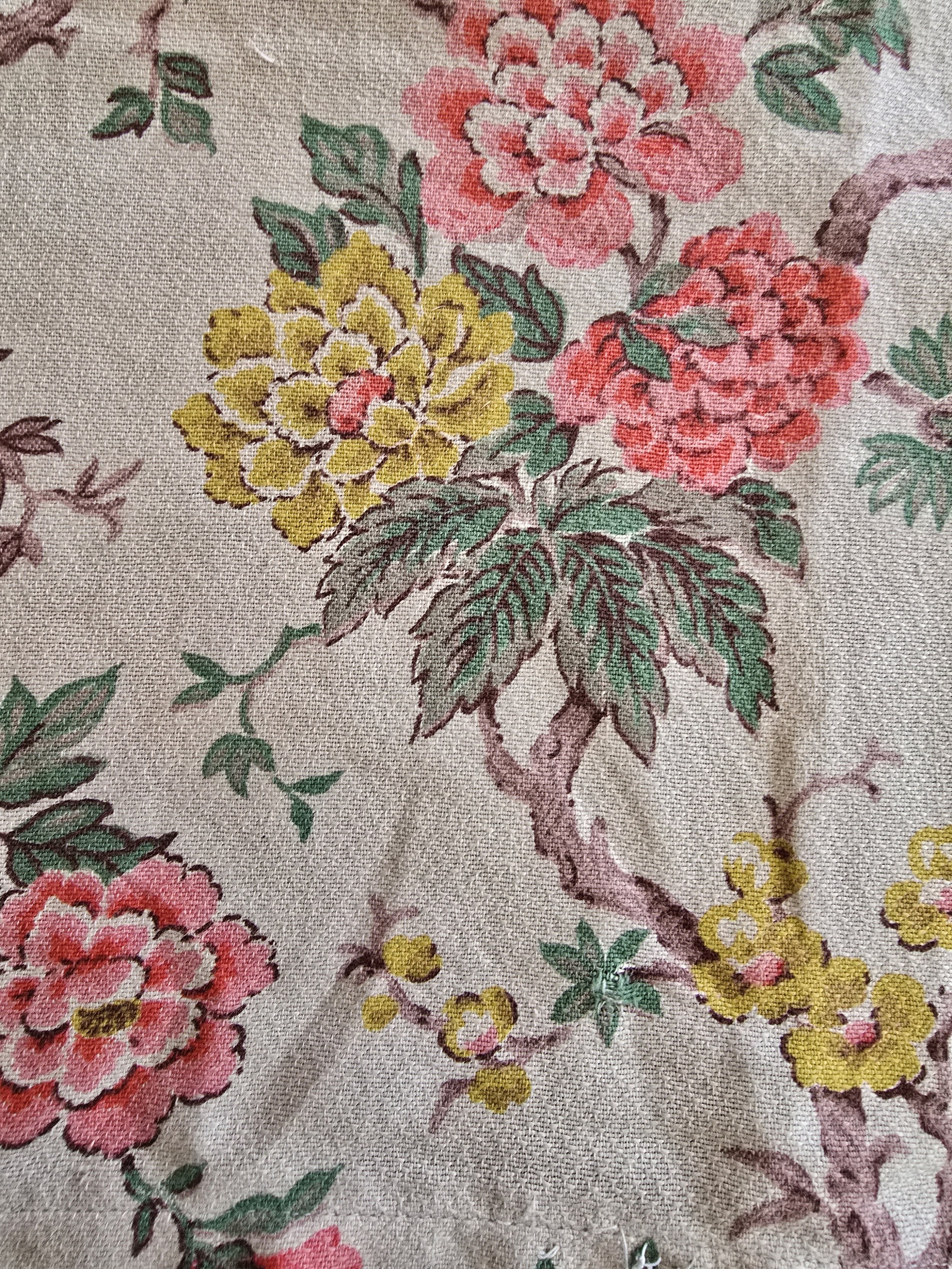 1950s floral textile in red, yellow and green with barkcloth-style weave