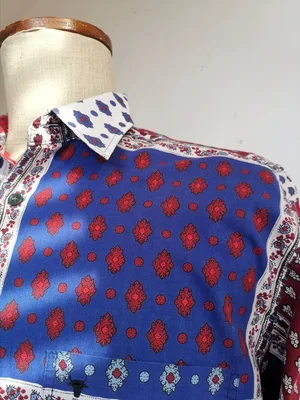 Collar detail showing red and white Provençale print on Souleiado shirt.