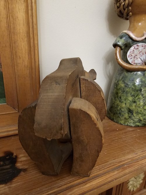 French wooden bear toy with visible wear, signed and museum-referenced
