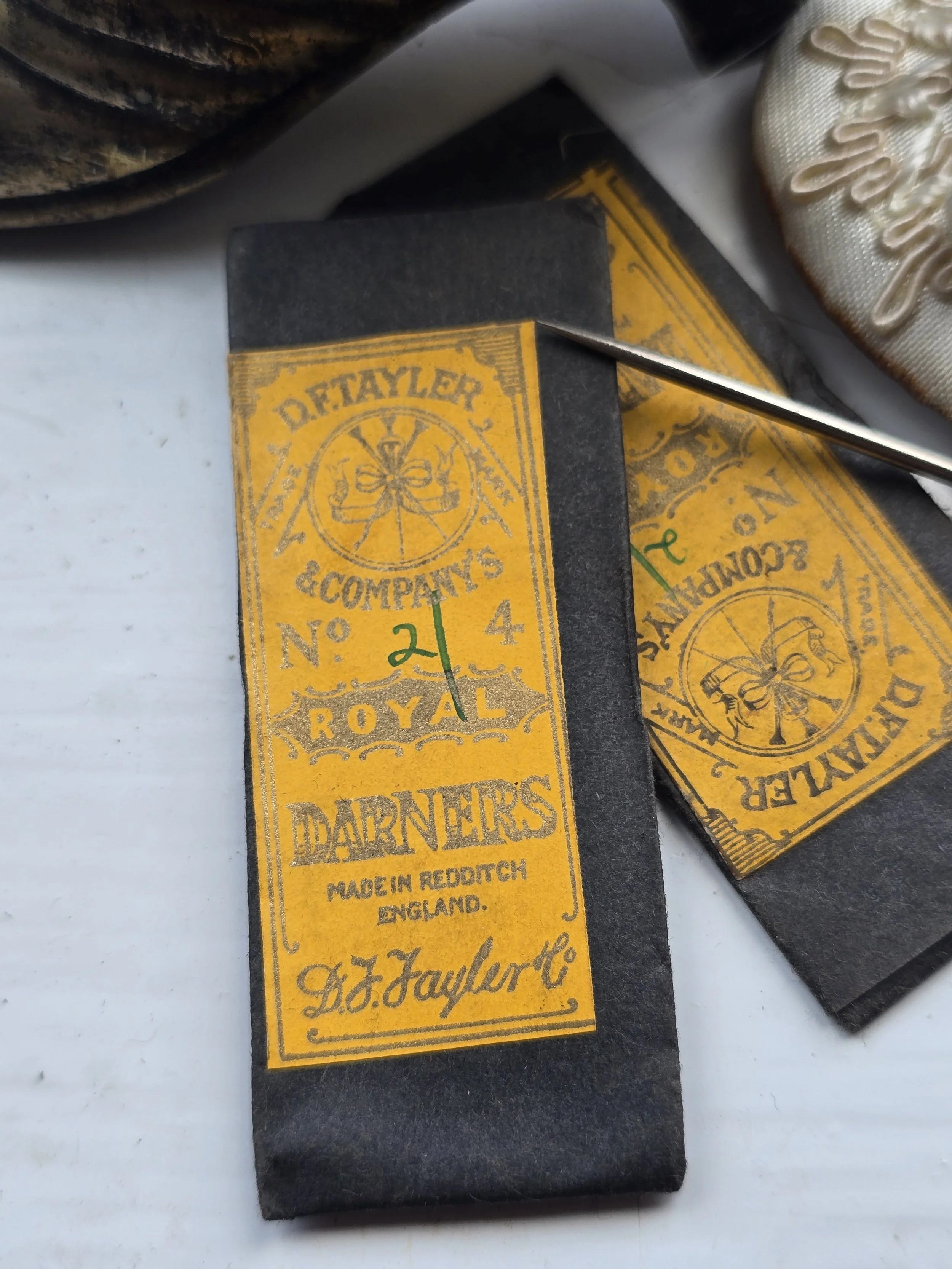 Antique sewing needle packet by D.F. Tayler & Co featuring the original yellow label and paper wrapper, sold individually.